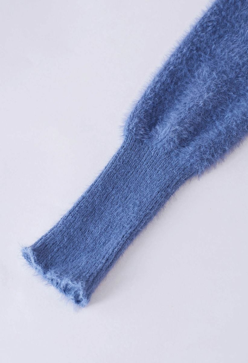 Jersey de punto borroso con cuello alto en azul de Cozy Perfection