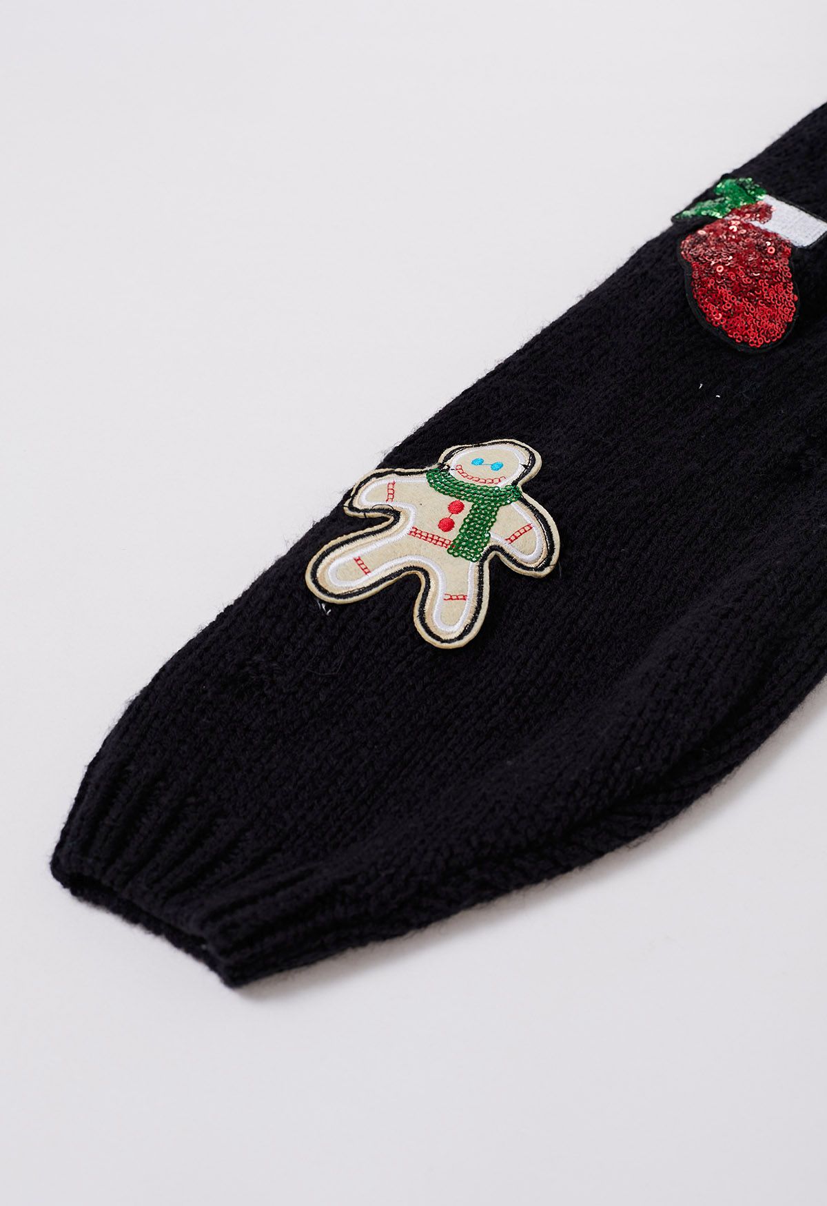 Cárdigan de punto de hombre de jengibre con lentejuelas y calcetín navideño en negro
