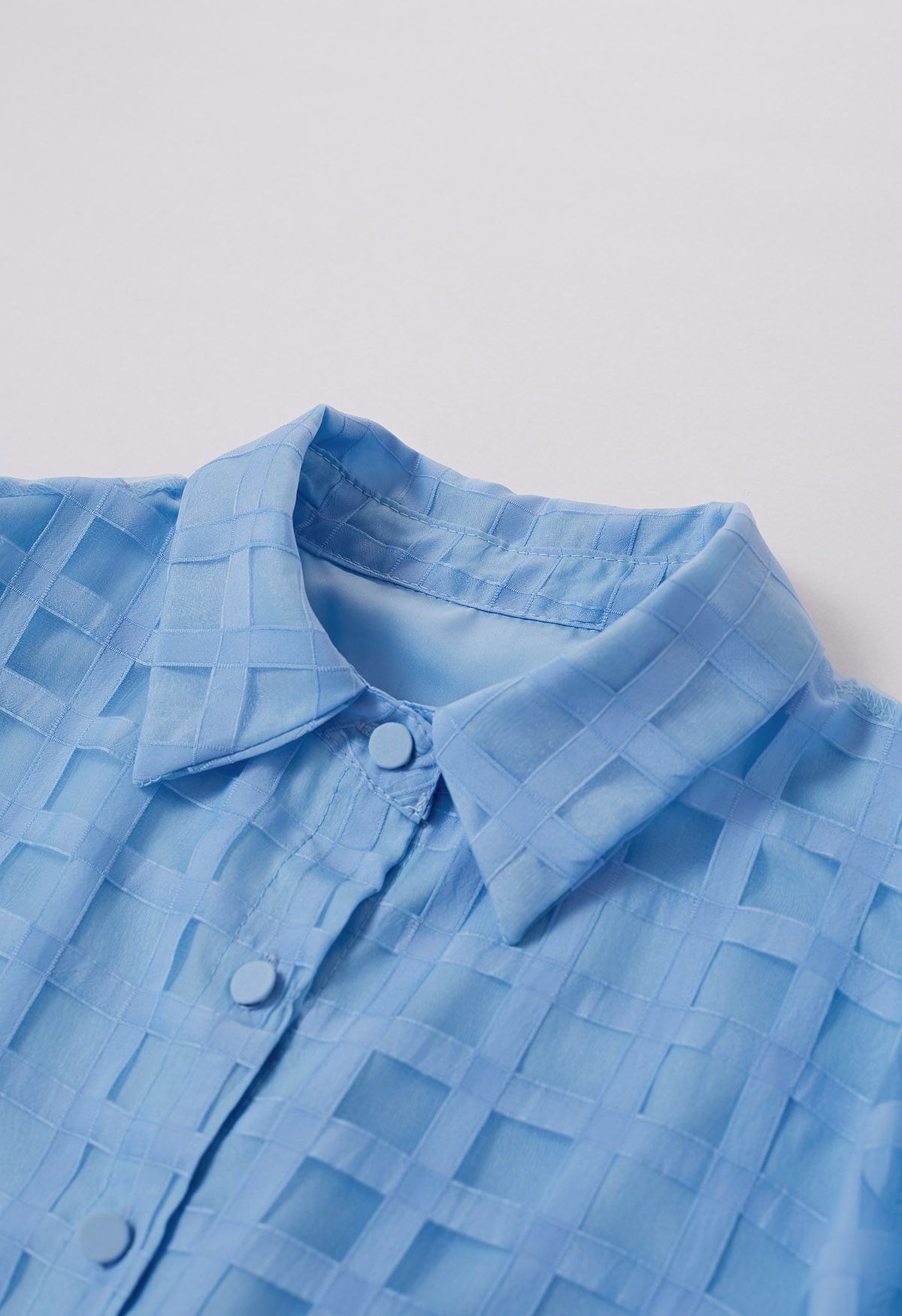 Camisa con botones y estampado de cuadros en azul