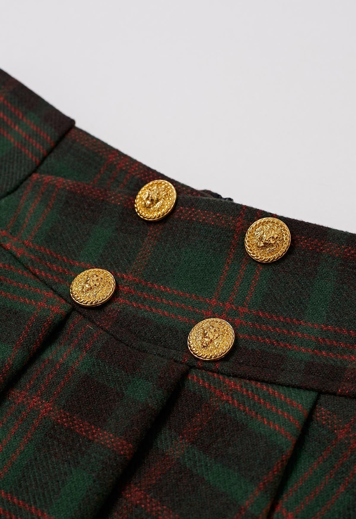 Minifalda plisada de mezcla de lana con botones dorados en cuadros verdes