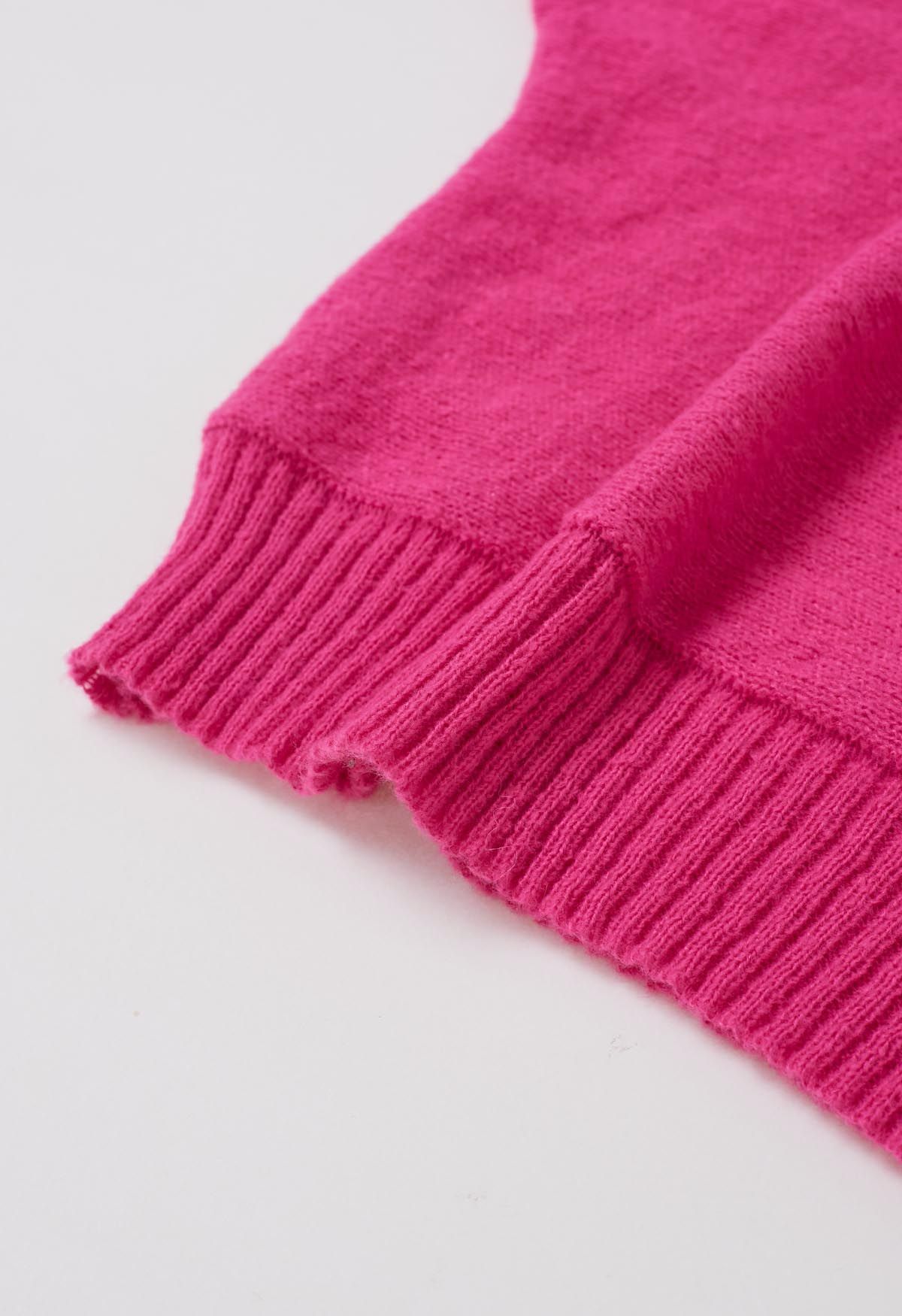 Suéter de punto con mangas de murciélago y cuello alto alegre en rosa fuerte