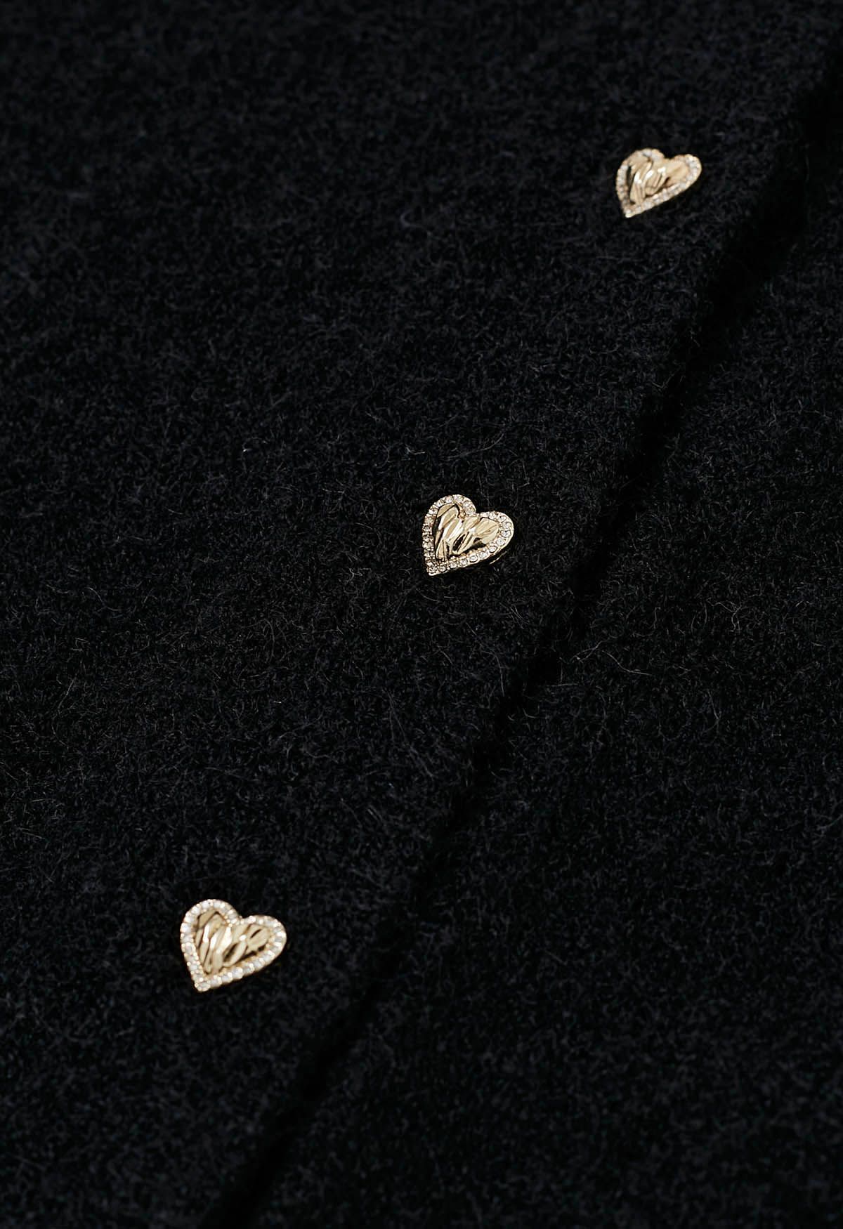 Cárdigan de punto borroso con botones de corazón y lazo con ojales bordados en negro