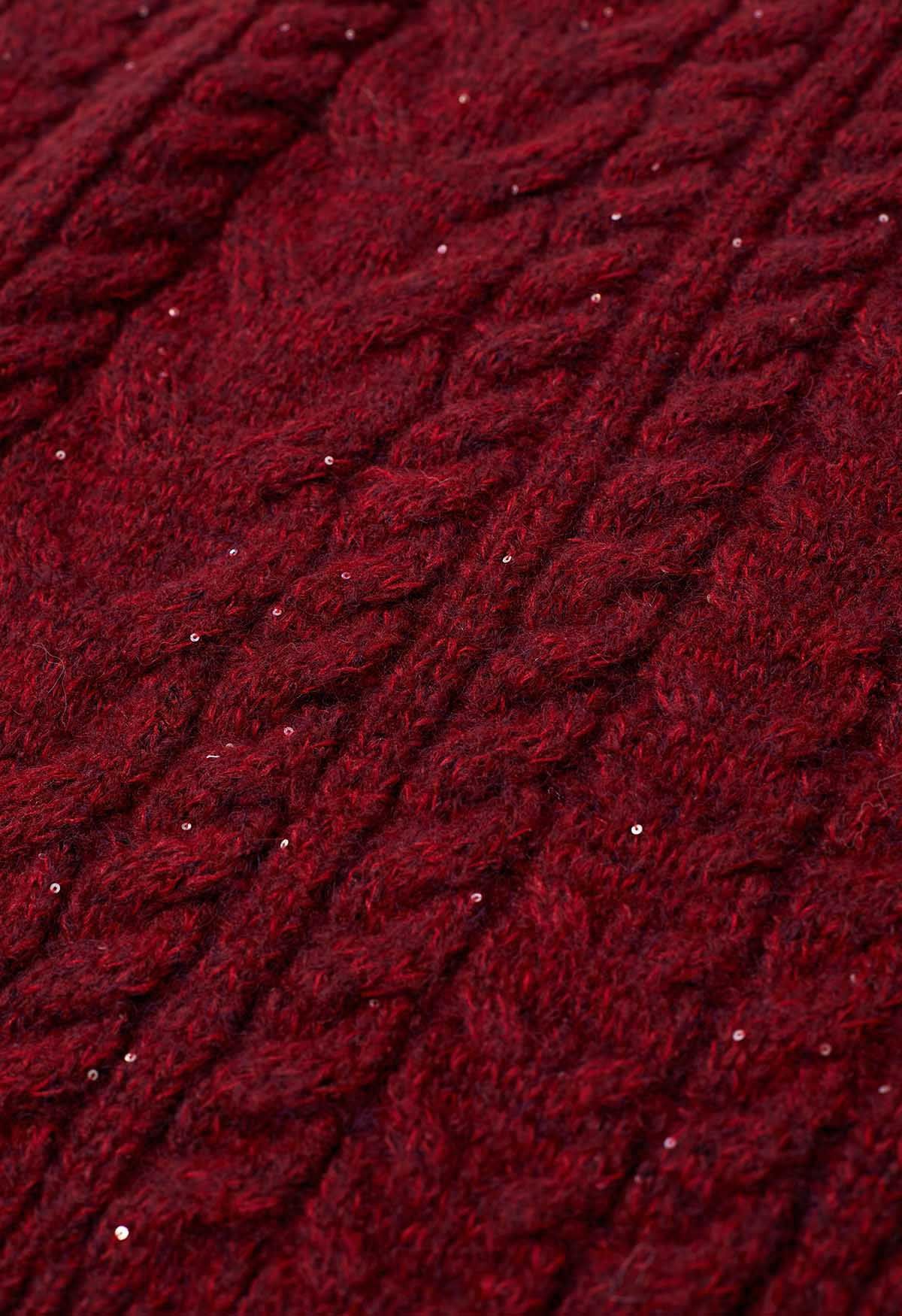 Jersey de punto de ochos con lentejuelas y cuello alto en rojo