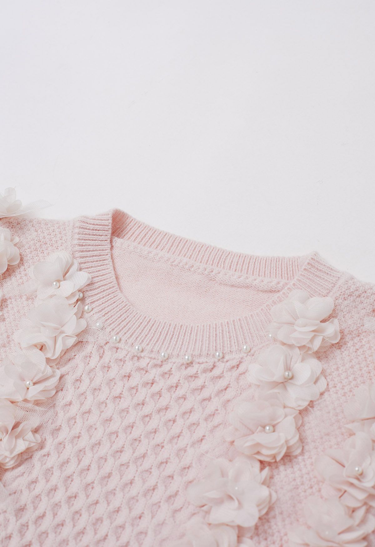 Suéter de punto nacarado con flores 3D en rosa