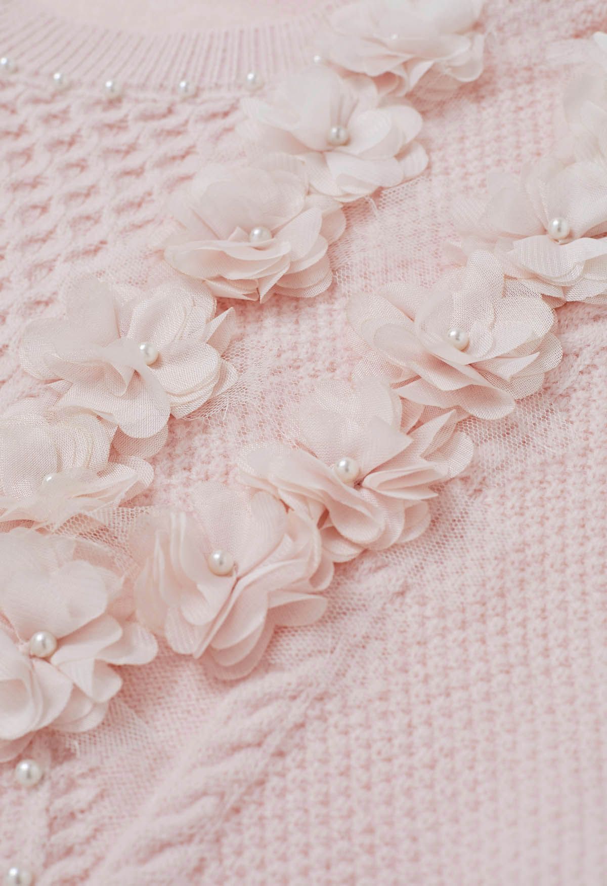 Suéter de punto nacarado con flores 3D en rosa