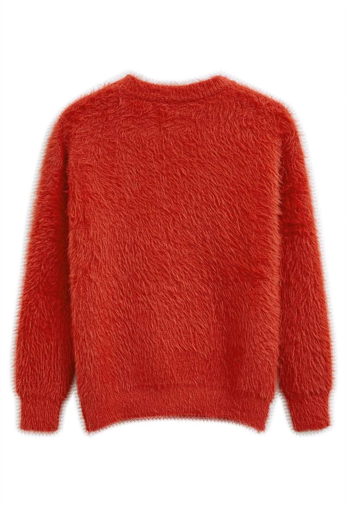 Suéter de punto borroso de color liso en naranja