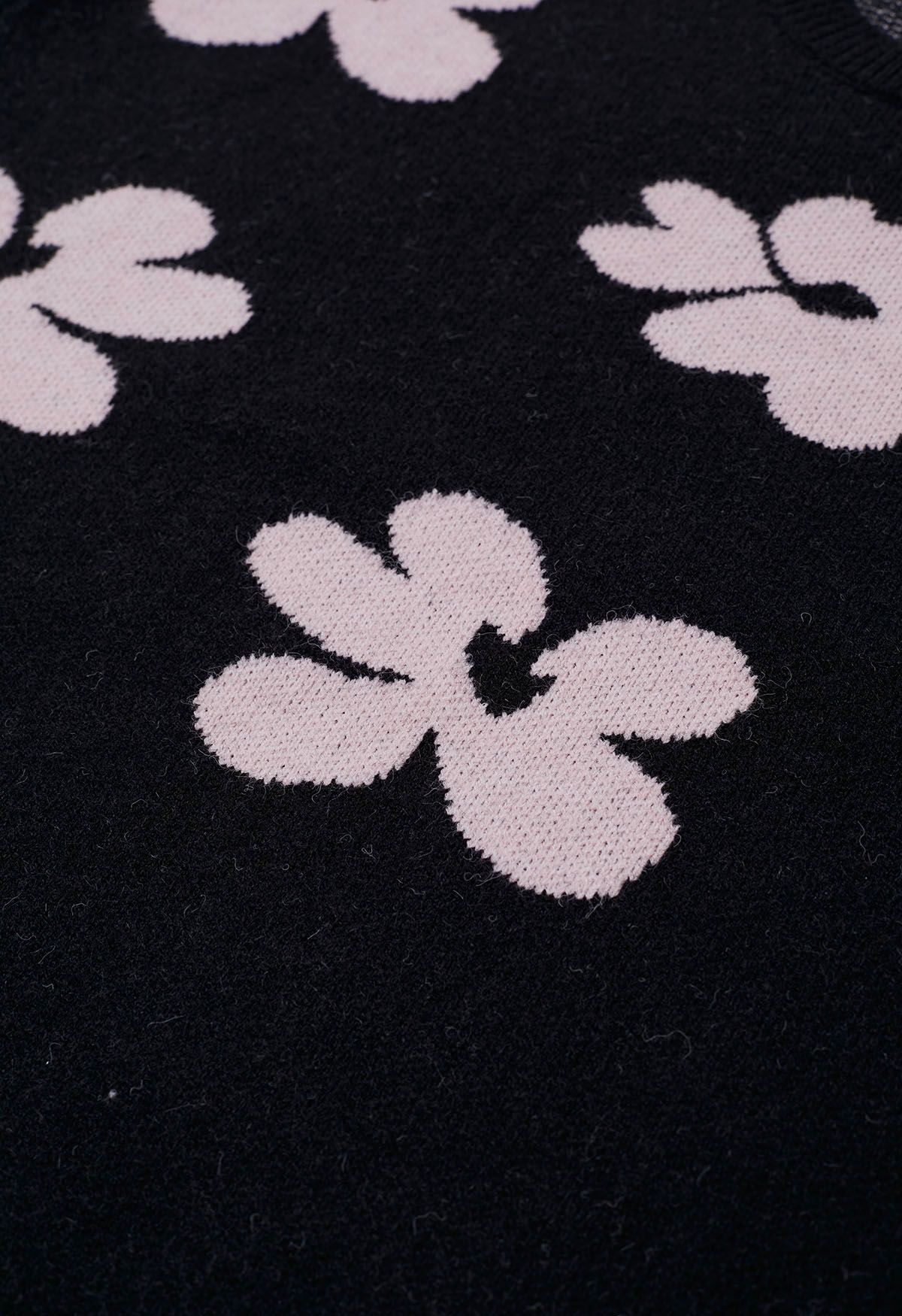 Suéter de punto con estampado de flores en contraste en negro