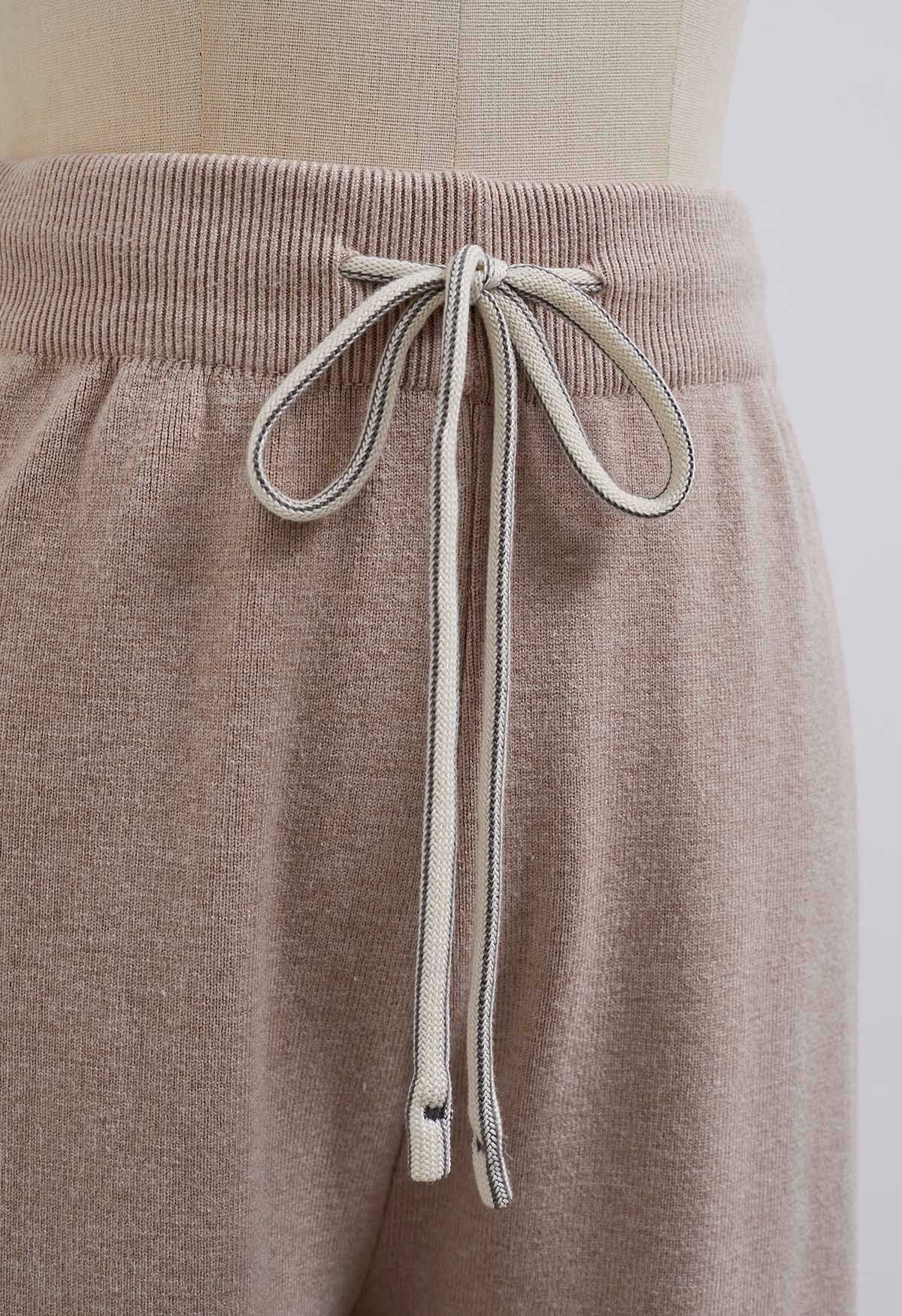 Pantalones de punto con cintura con cordón y detalle de canalé en color avena