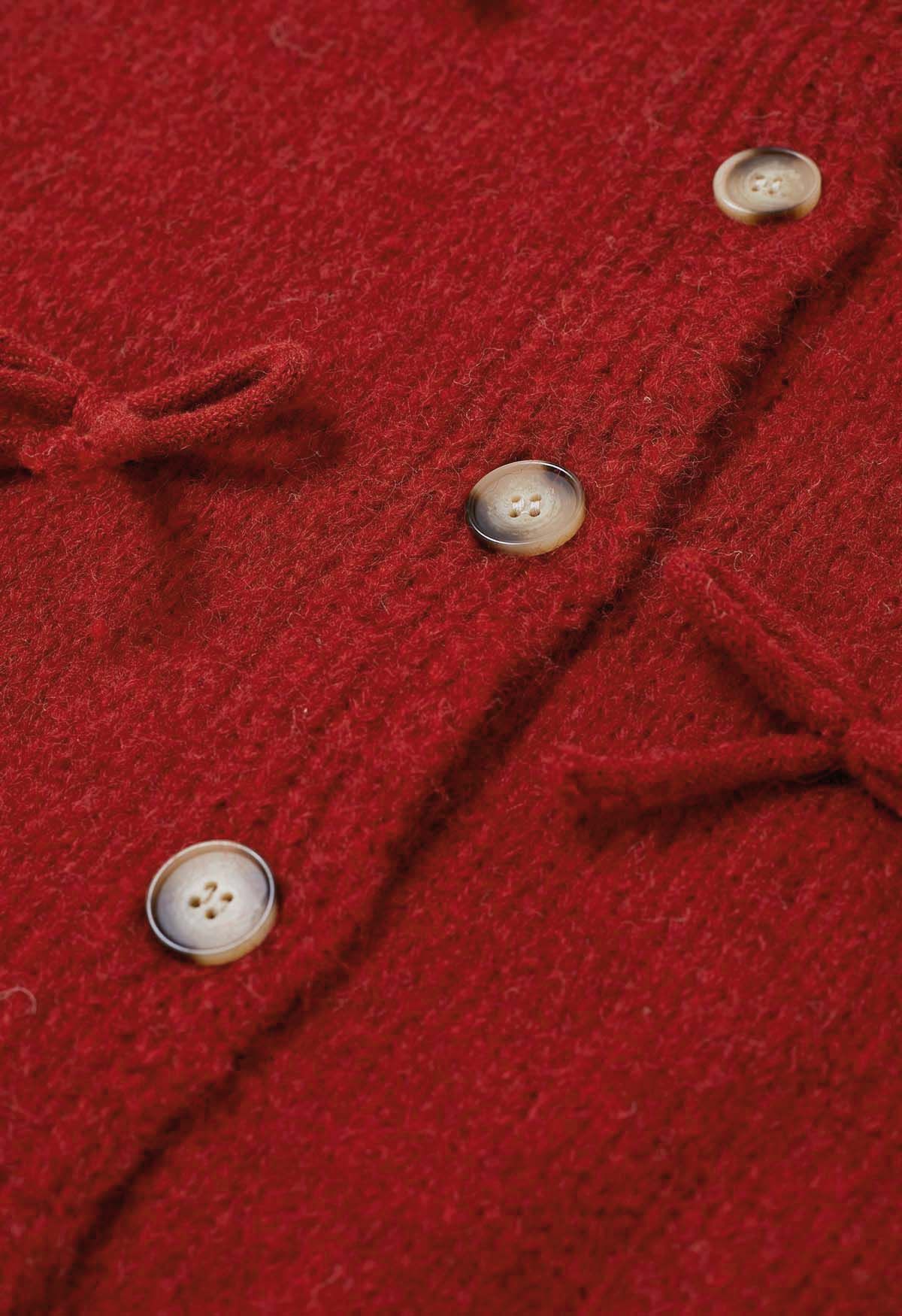 Adorable cárdigan de punto con botones y lazo en rojo