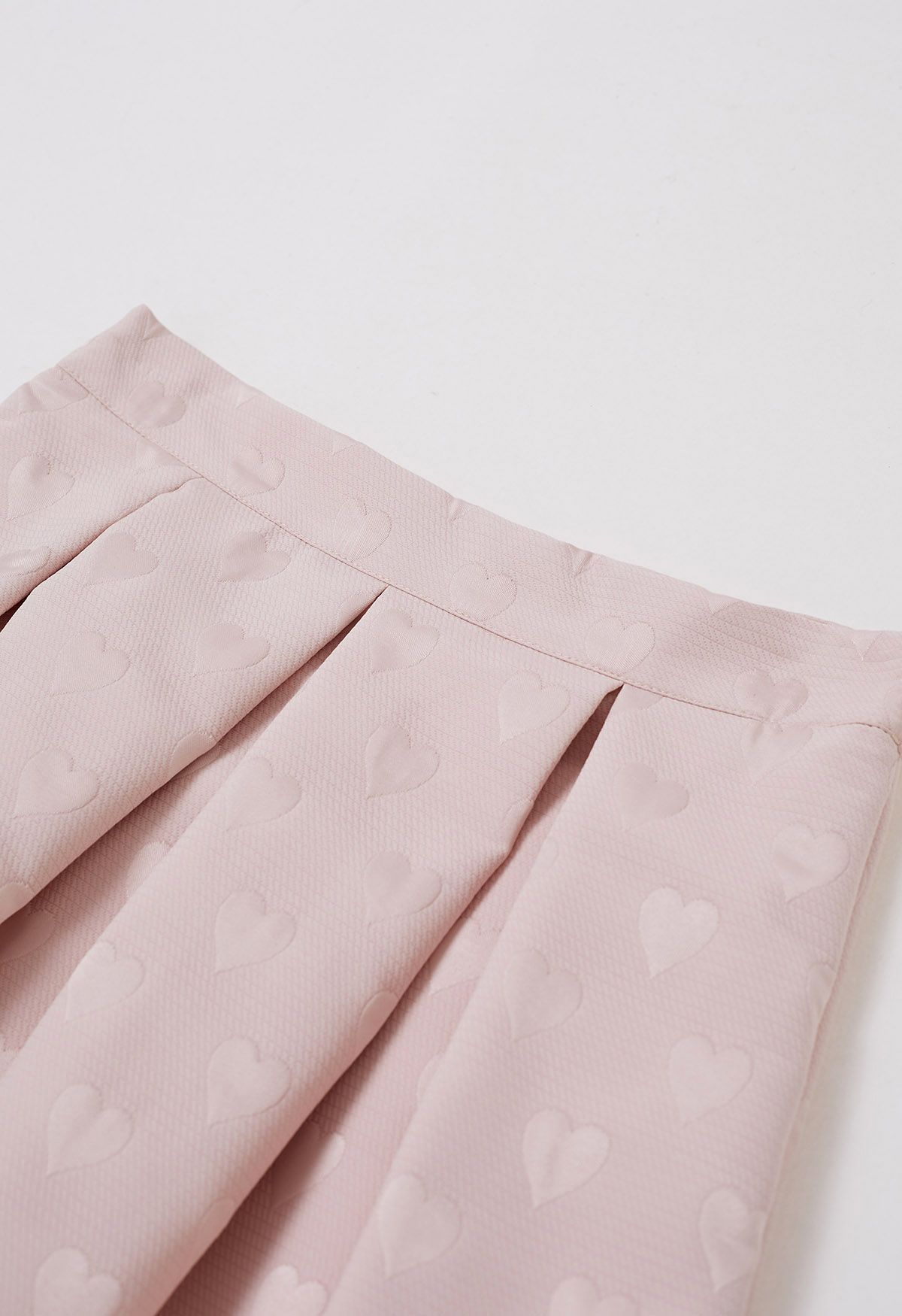Falda midi de vuelo plisada de jacquard con corazón en relieve en rosa claro