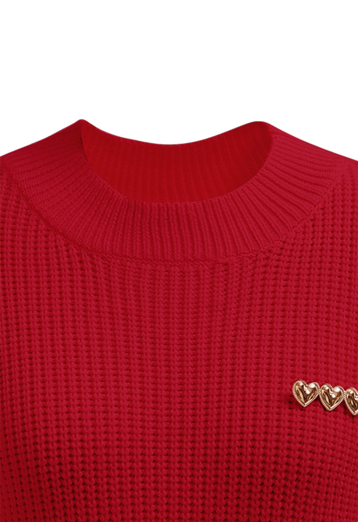 Jersey de punto con manga al codo y broche de corazón en rojo