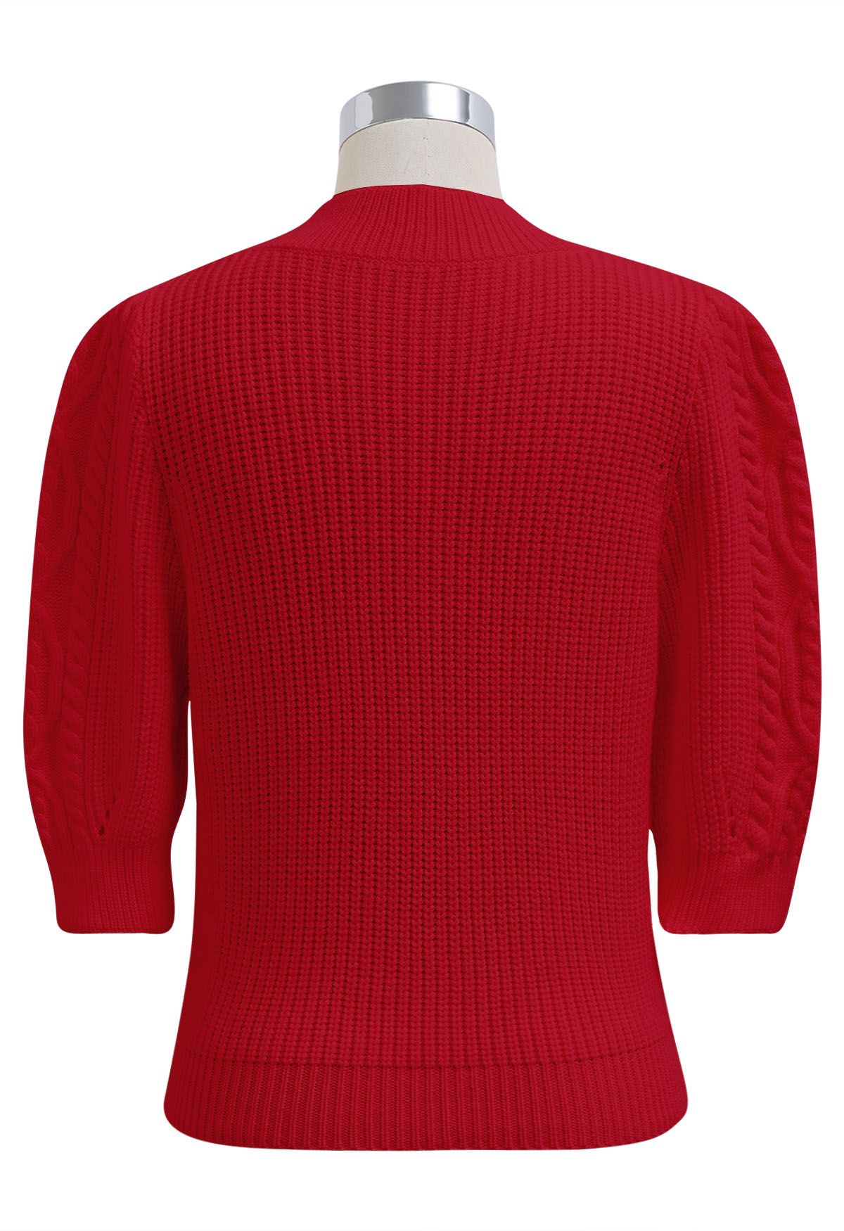 Jersey de punto con manga al codo y broche de corazón en rojo