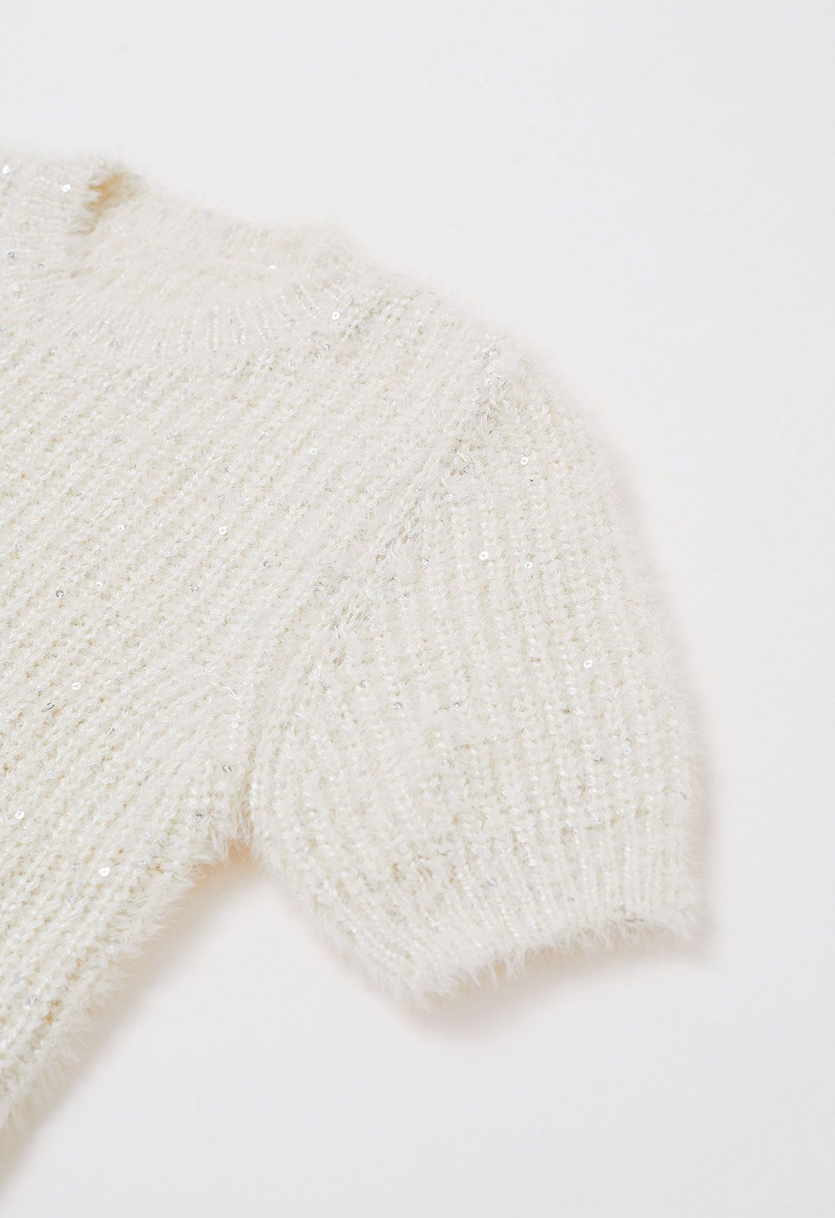 Suéter de manga corta con lentejuelas en color crema
