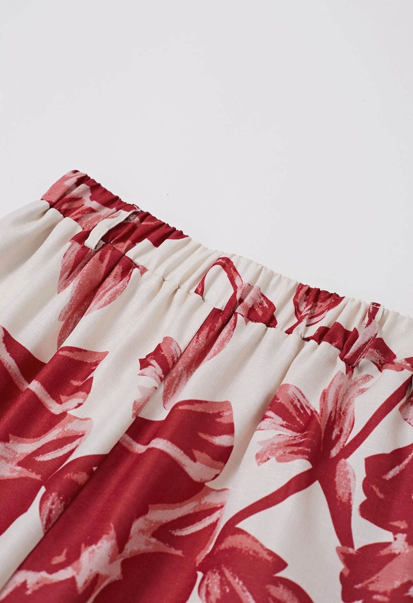 Pantalones anchos con estampado de ramo rojo