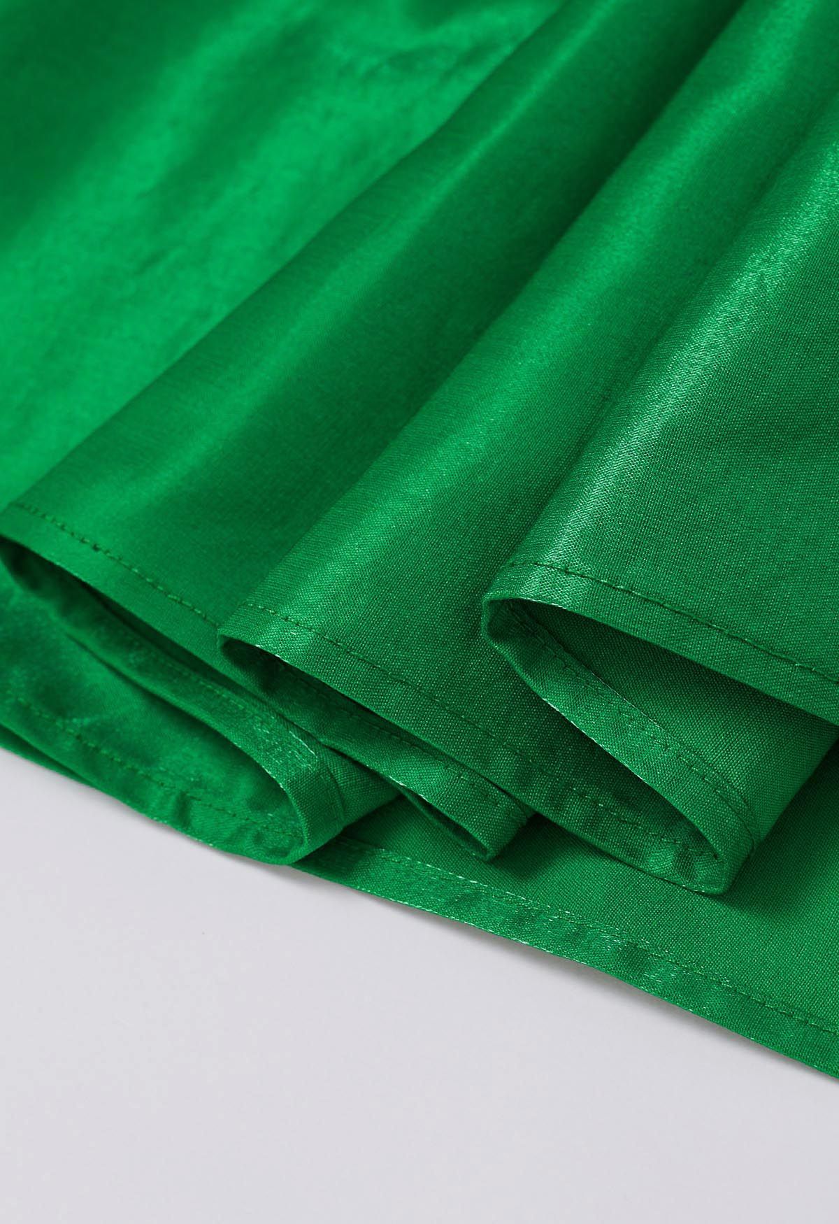 Falda midi plisada brillante en verde