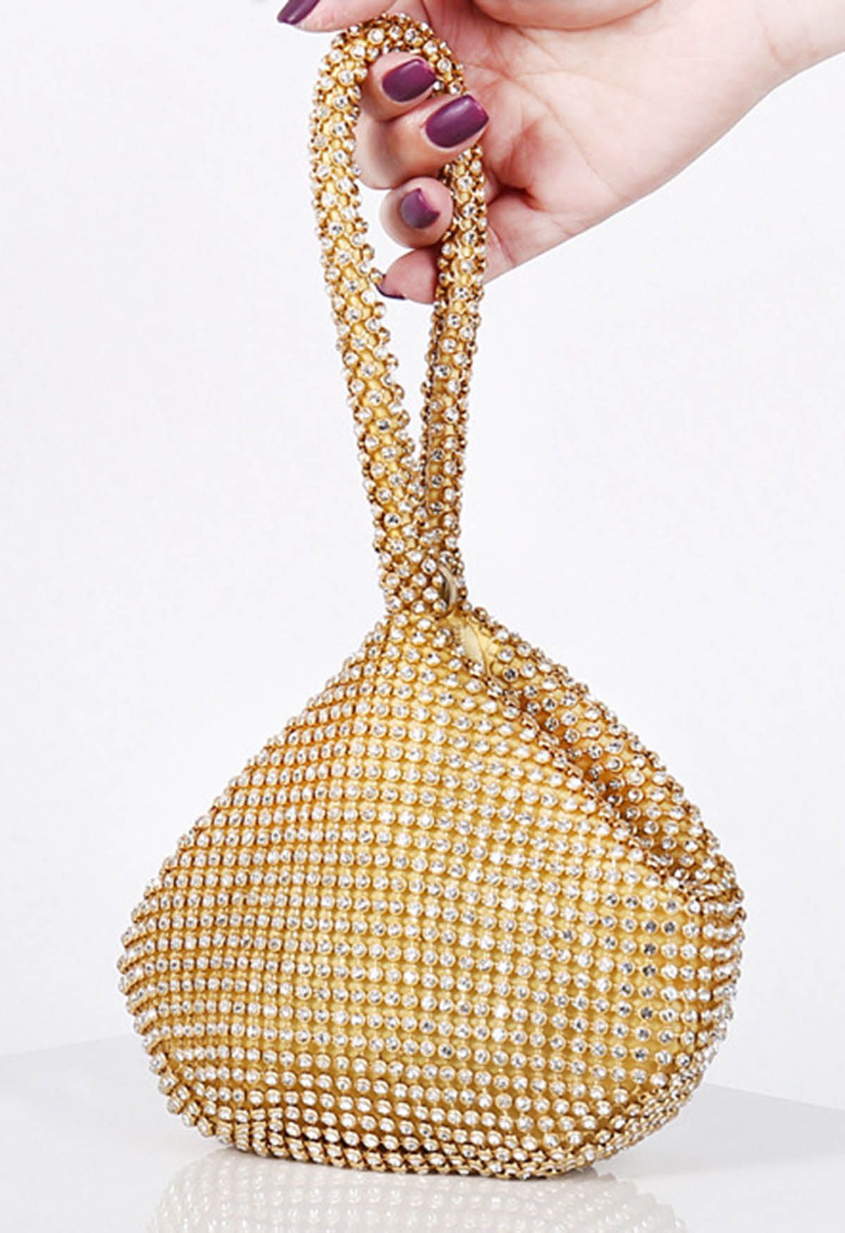 Mini bolso de mano con diamantes de imitación en oro