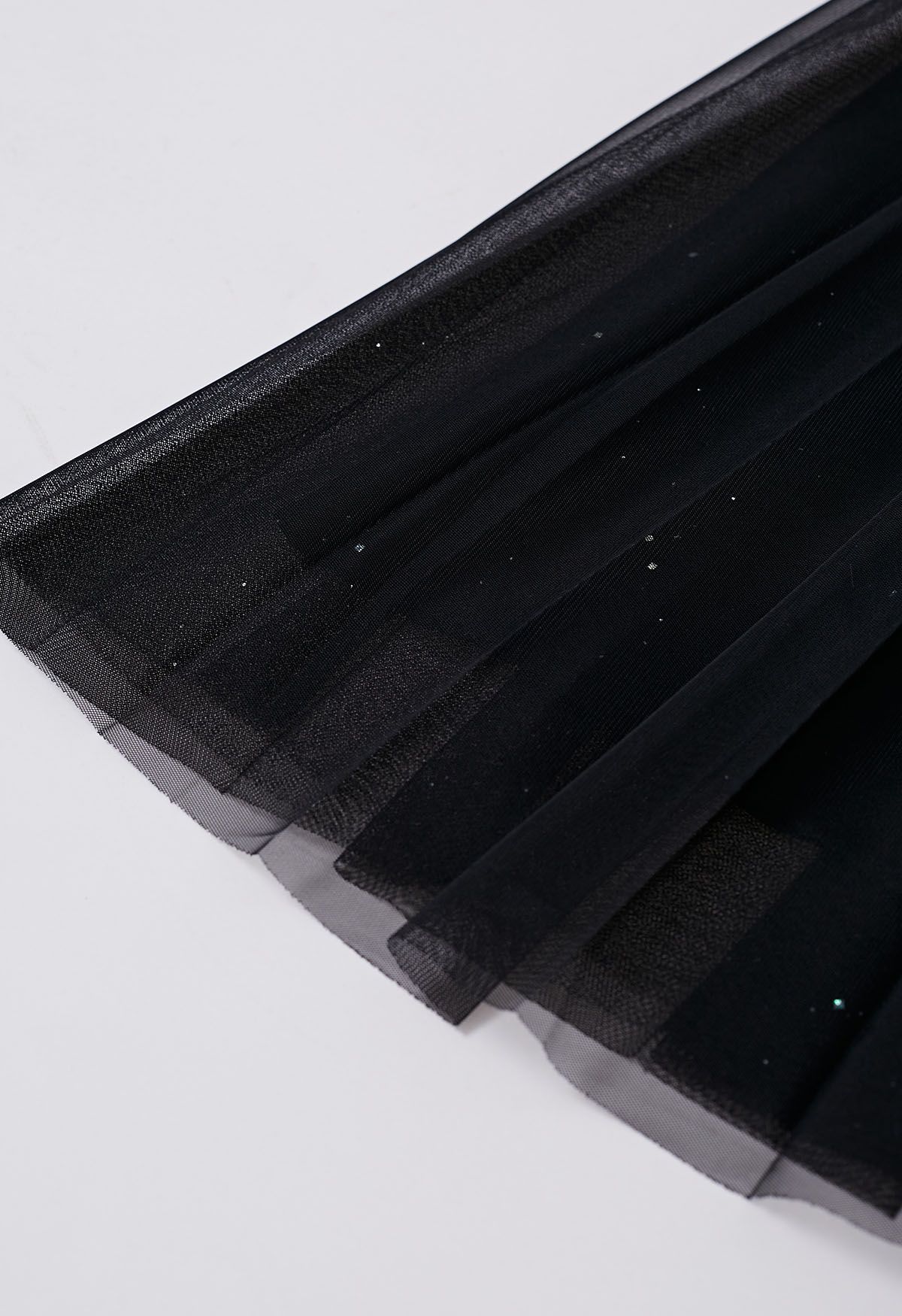 Falda de tul de malla plisada con ribete de purpurina en negro