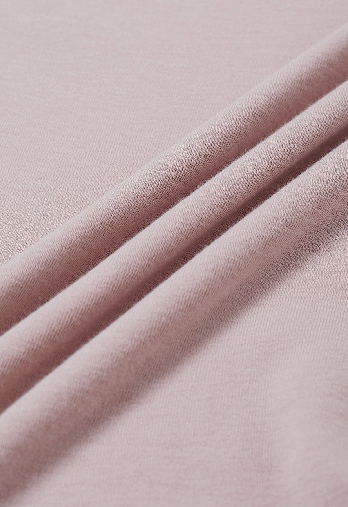 Top de algodón liso con cuello doblado en rosa