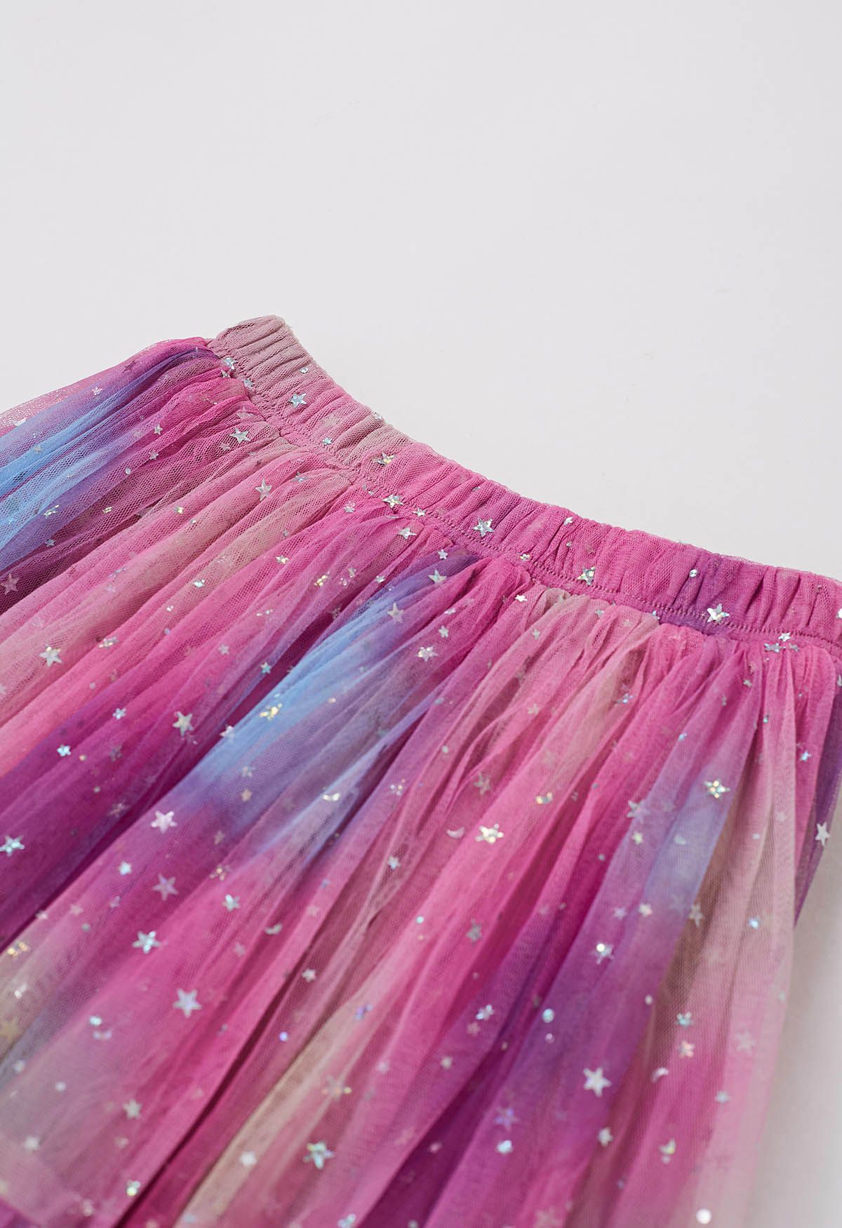 Falda de malla colorida con estrellas brillantes