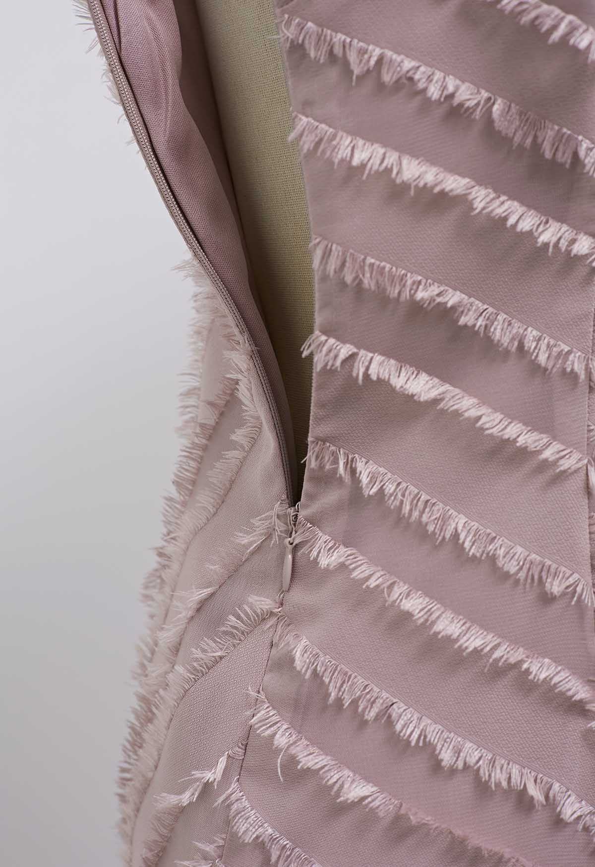 Vestido camisola dividido con rayas y flecos en rosa