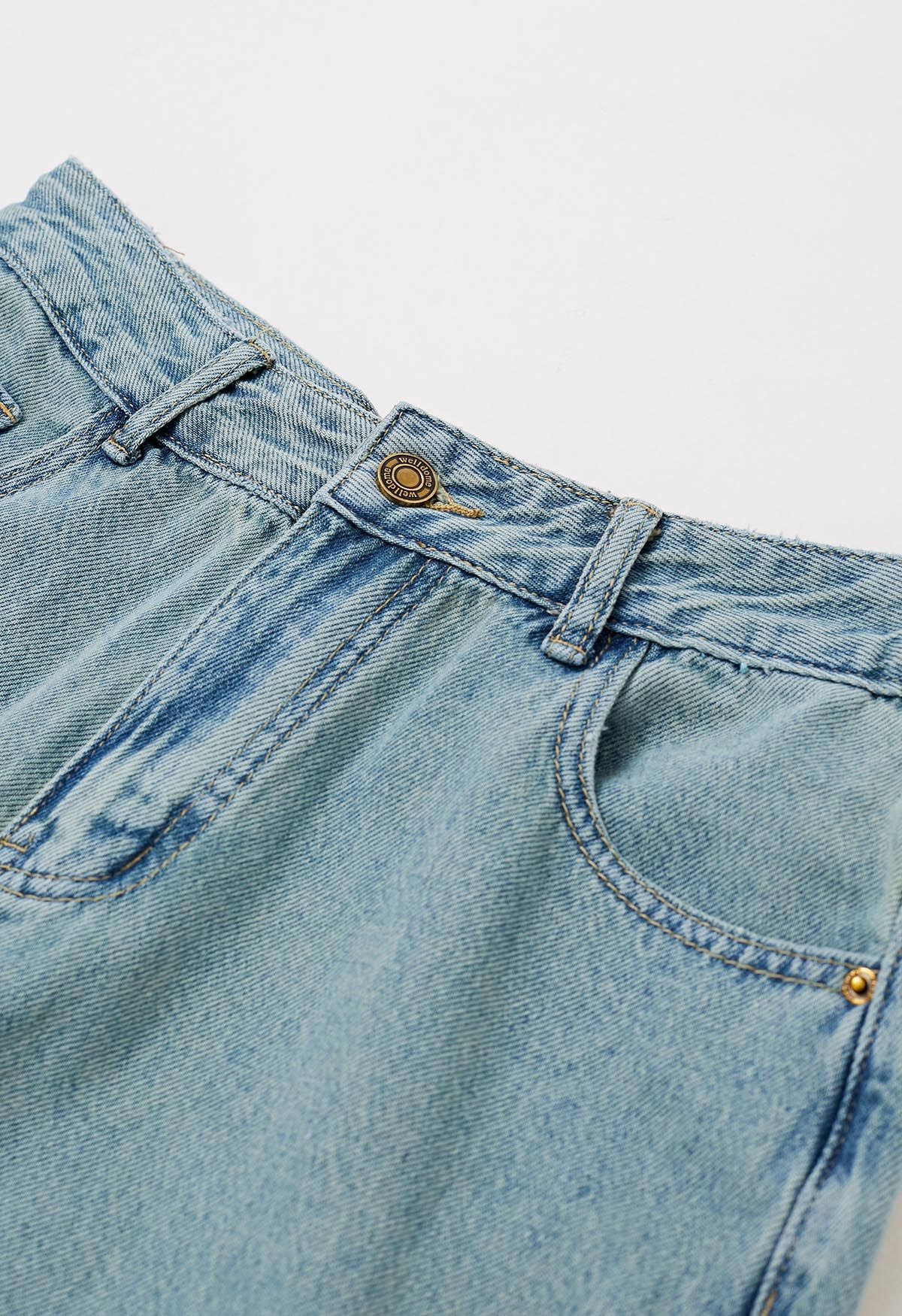 Jeans rectos con dobladillo teñido anudado