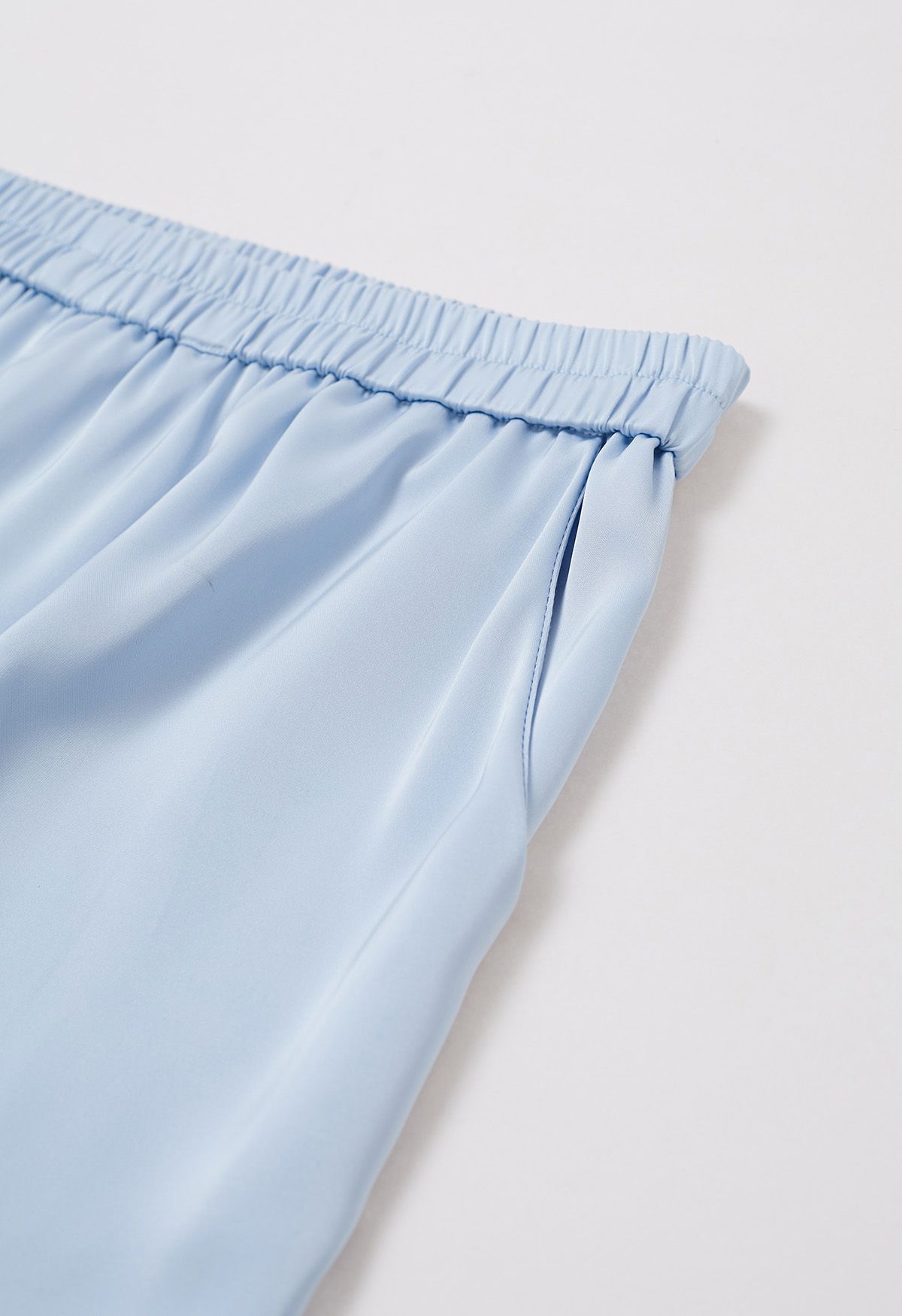 Pantalones sin cordones con acabado satinado en azul