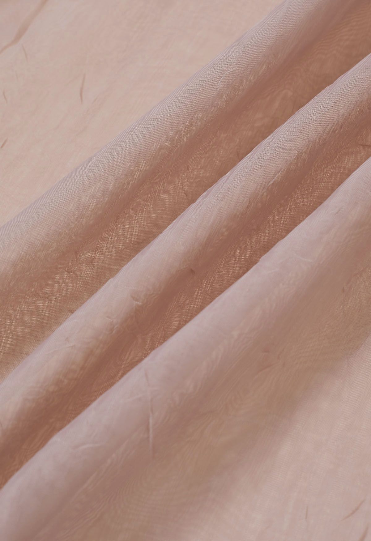 Rose Broche Top transparente con textura y mangas abullonadas en rosa