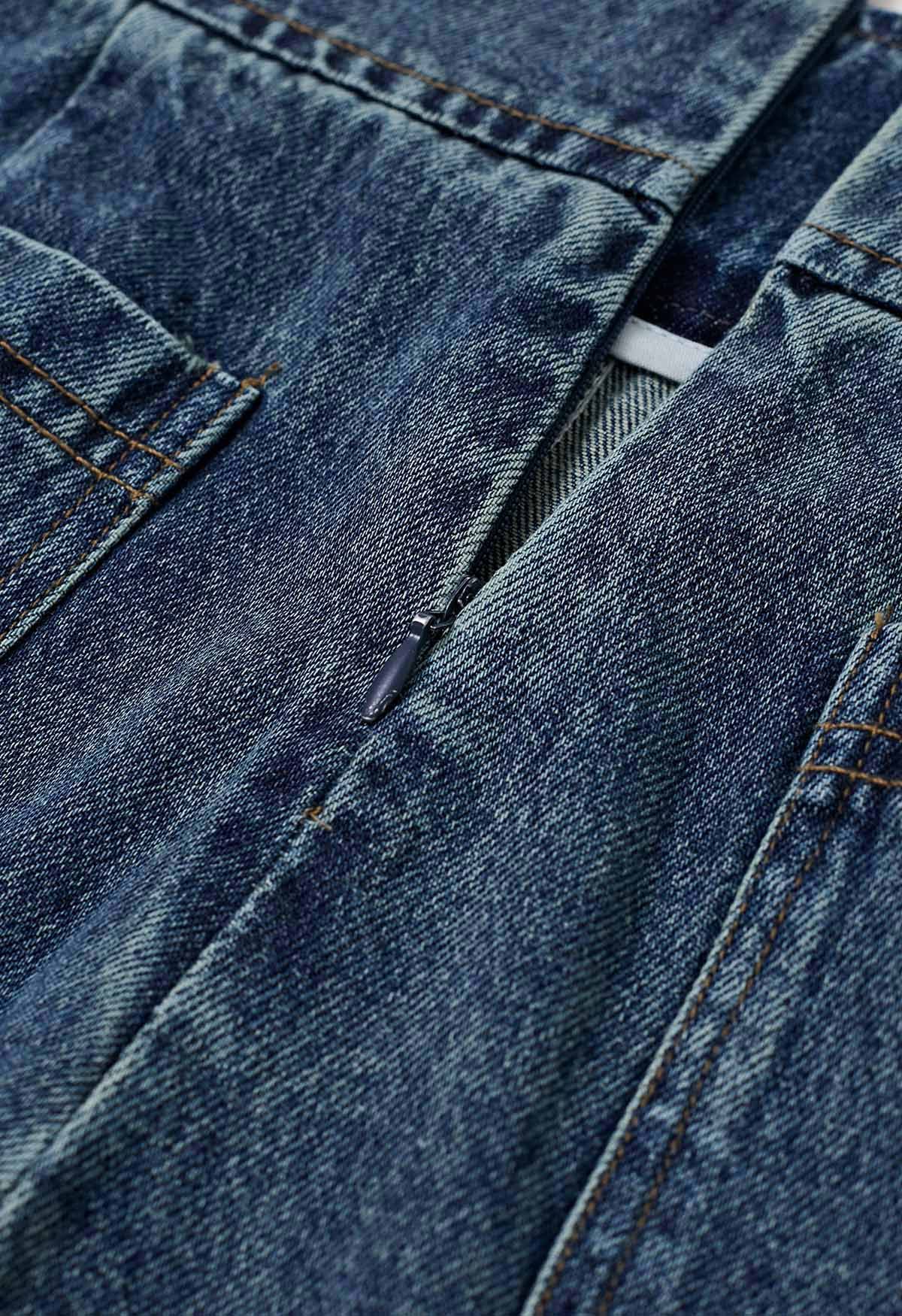 Falda pantalón vaquera con cinturón y bolsillos falsos con solapa en azul
