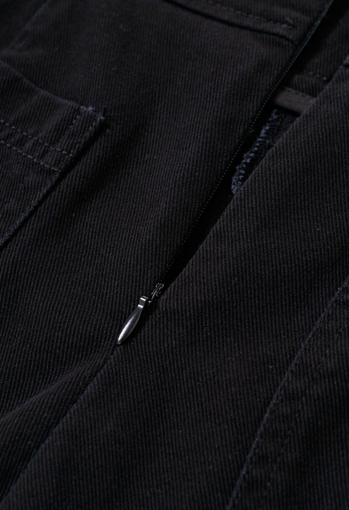 Falda pantalón vaquera con cinturón y bolsillos falsos con solapa en negro