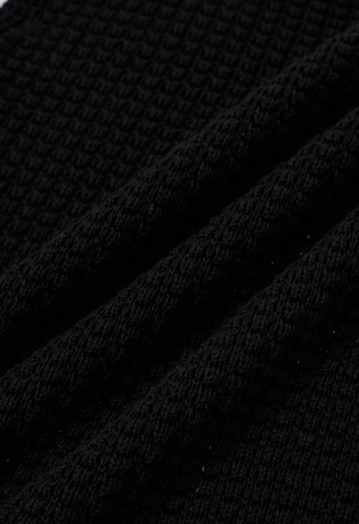 Top sin mangas de punto calado de color liso en negro
