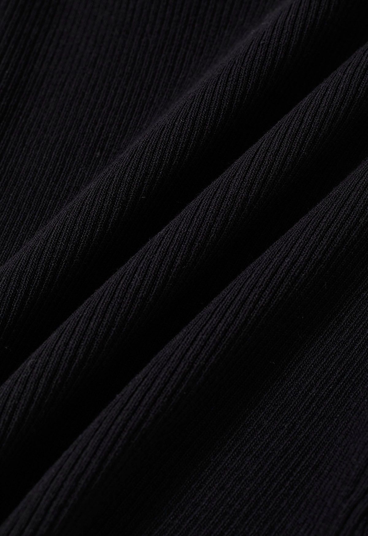 Camiseta sin mangas de punto falsa de dos piezas en negro