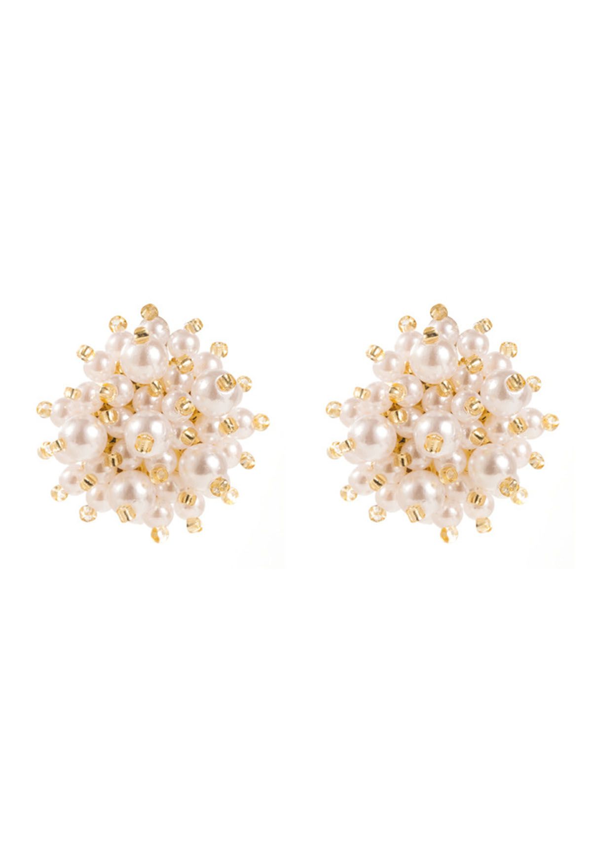 Aretes con perlas y concha de flores