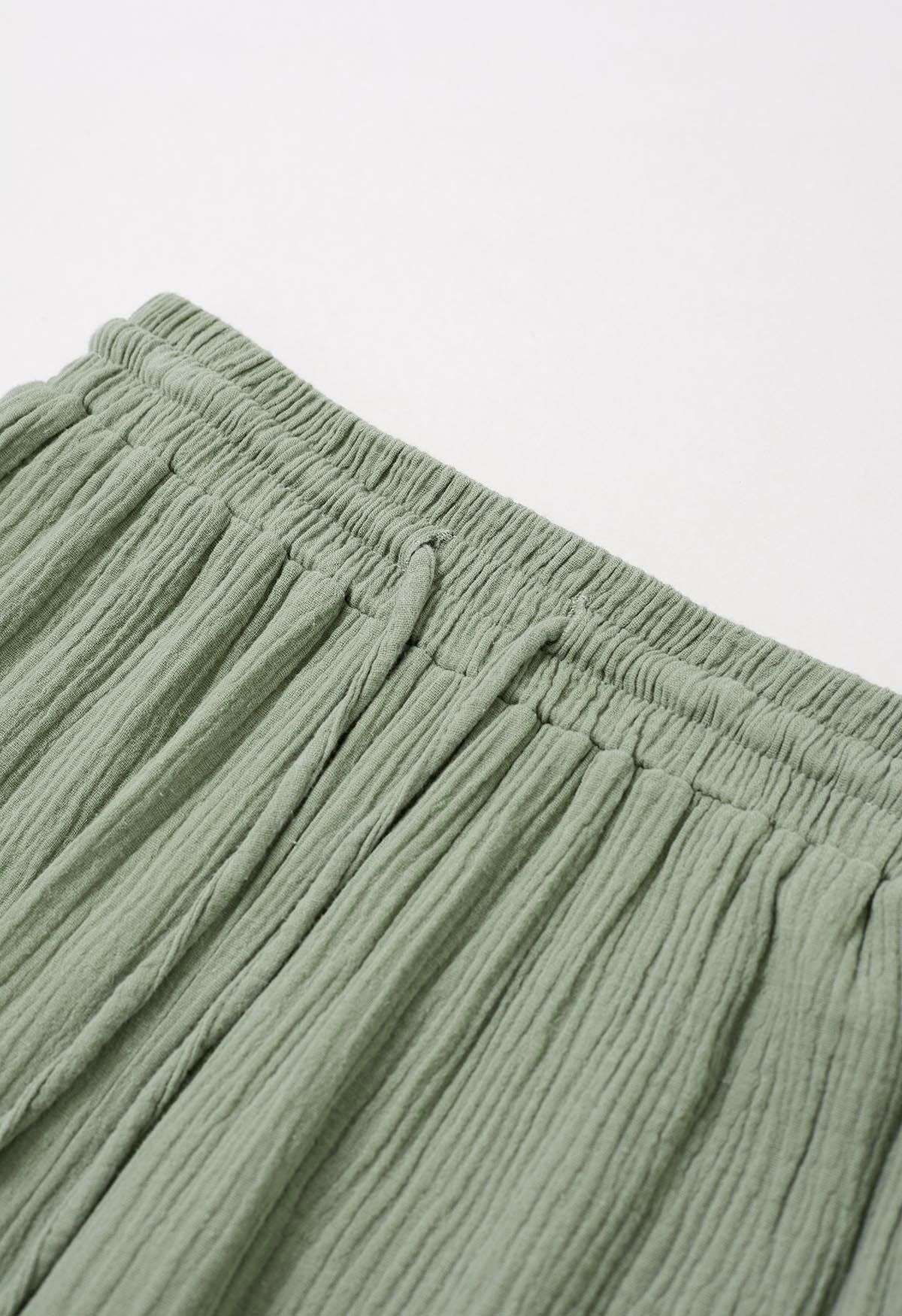 Pantalones ligeros de algodón con cordón en verde guisante