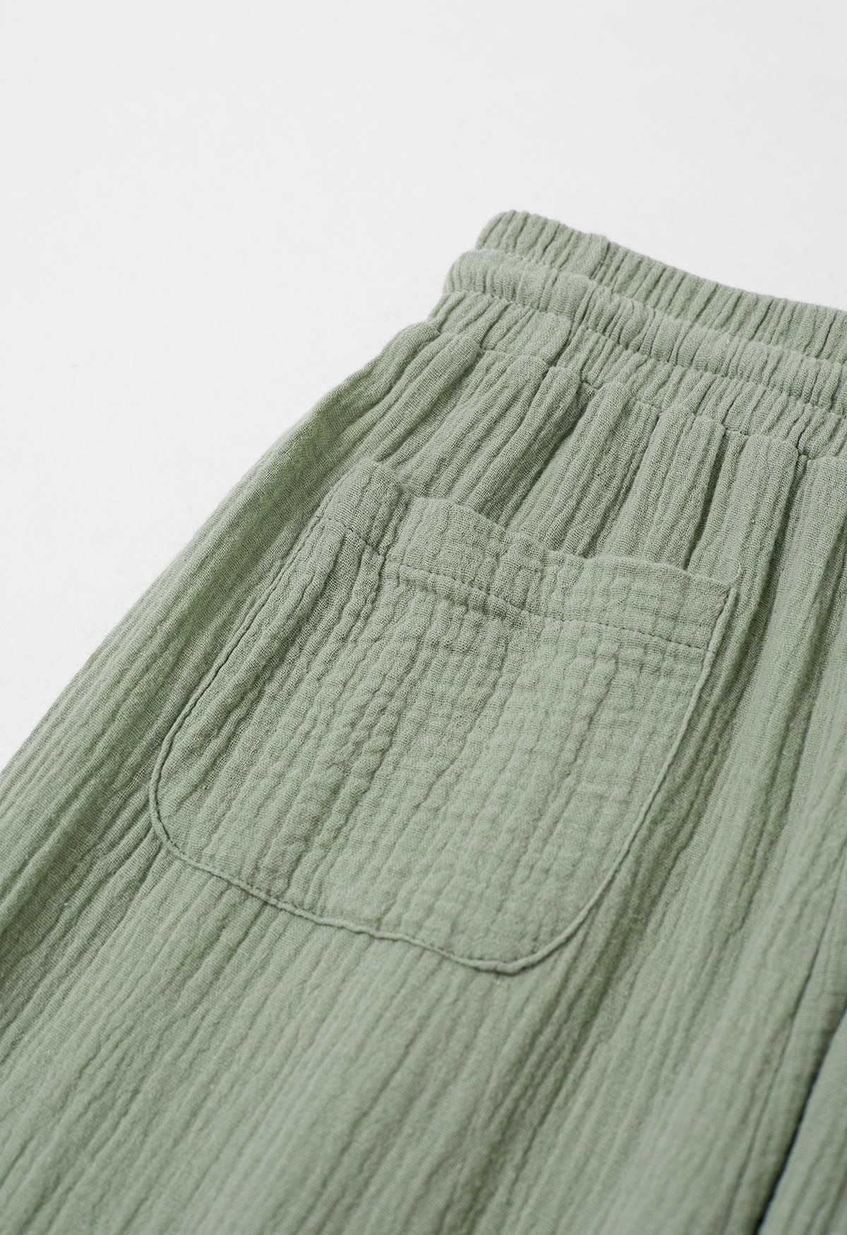 Pantalones ligeros de algodón con cordón en verde guisante