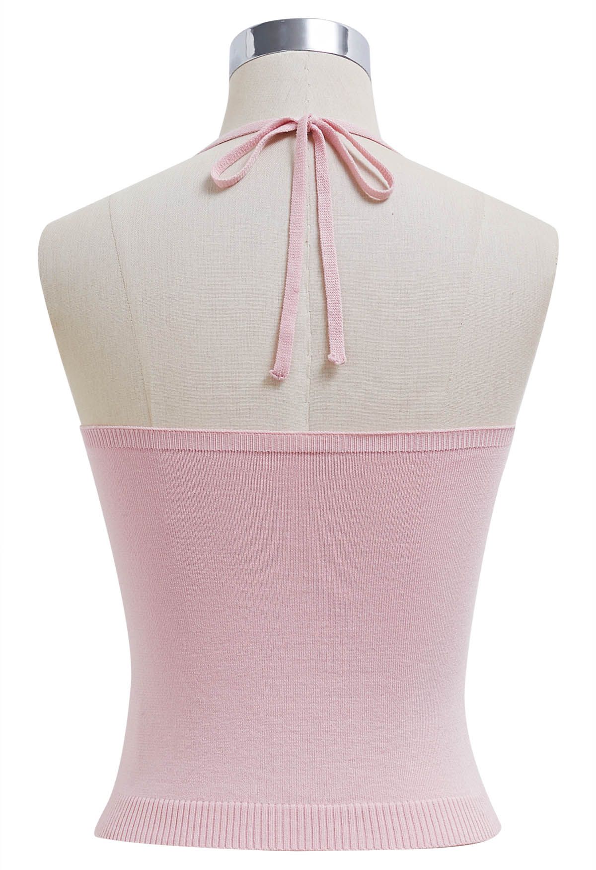 Top de punto con escote halter y detalle de pinzas en rosa