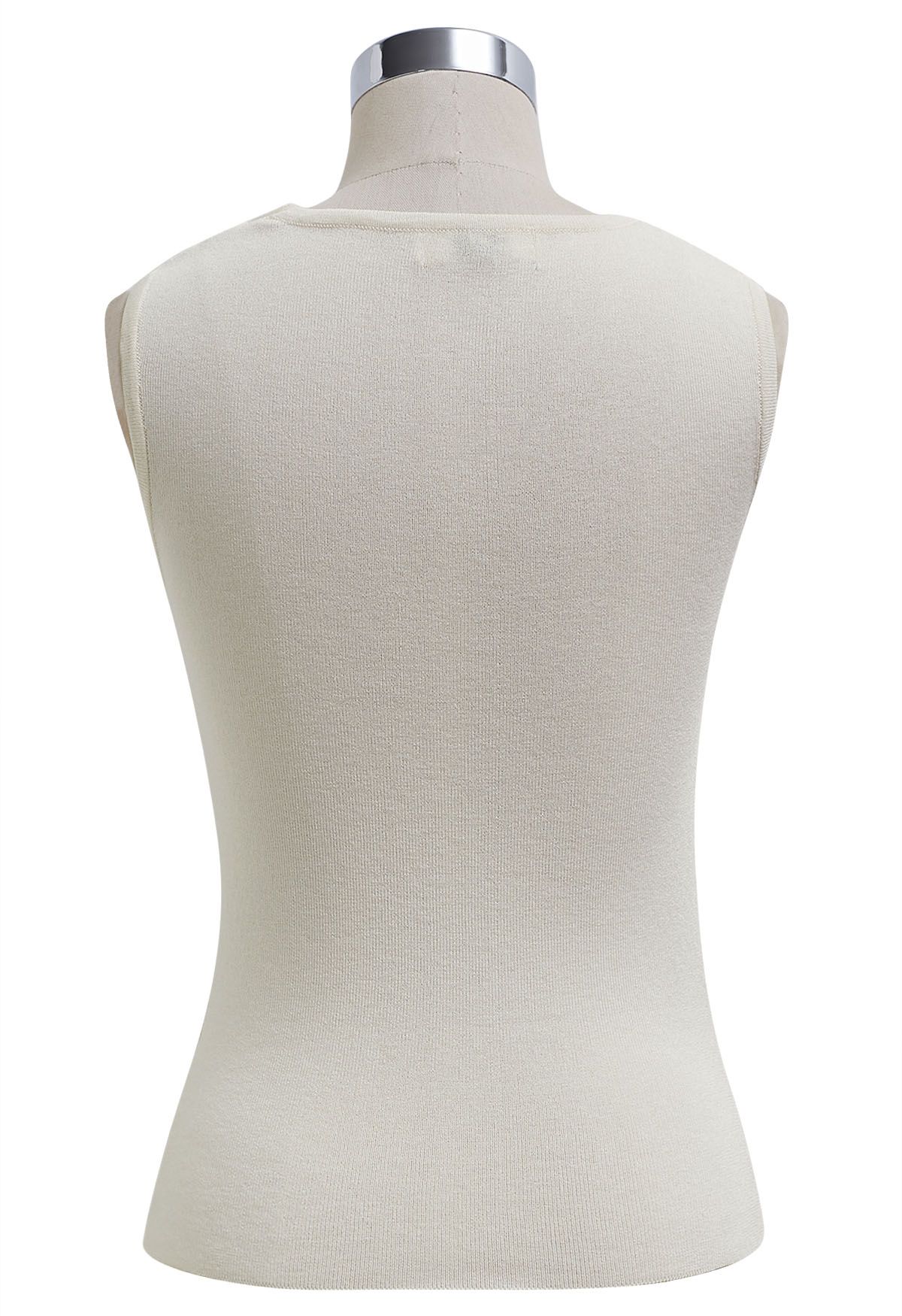 Top de punto sin mangas con nudo lateral en color crema