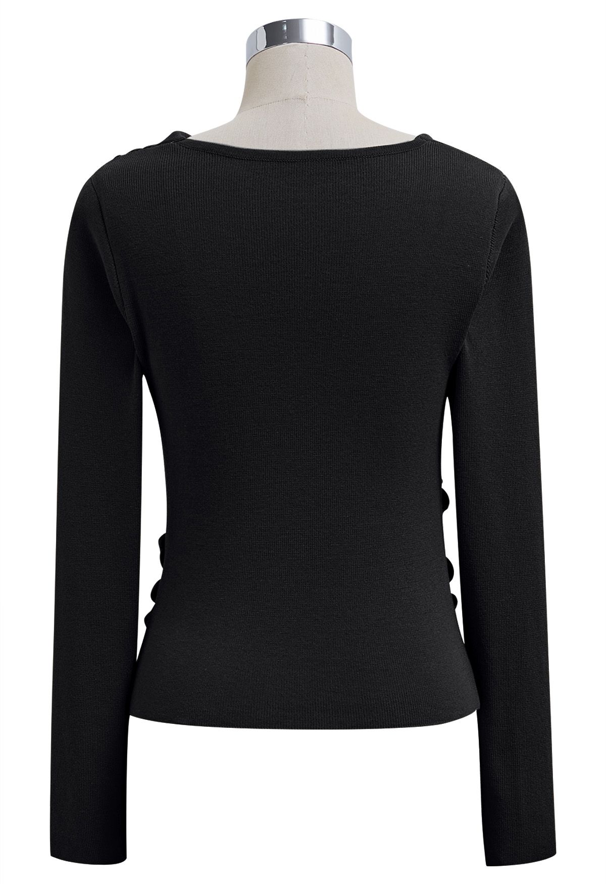 Blusa de punto con mangas largas fruncidas y nudo lateral en color negro