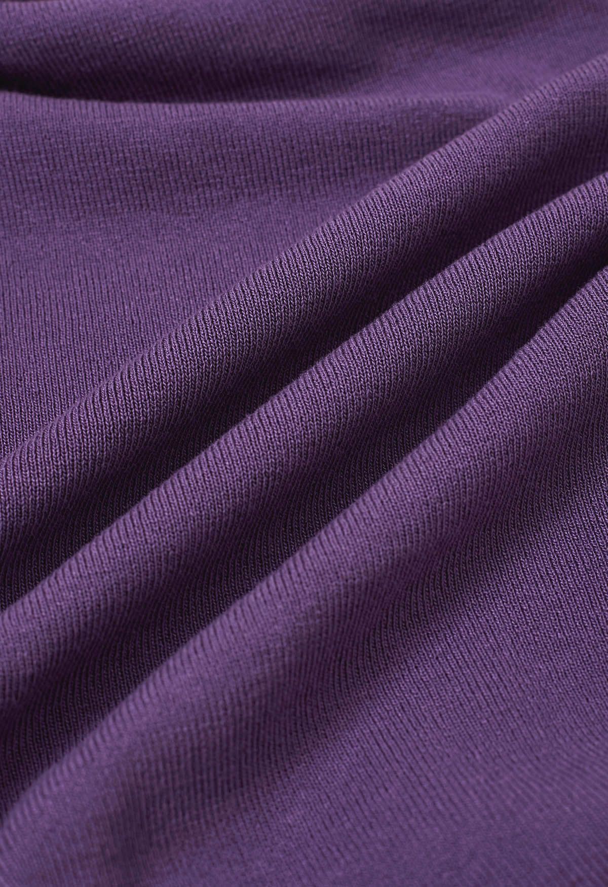 Blusa de punto con mangas largas fruncidas y nudo lateral en violeta