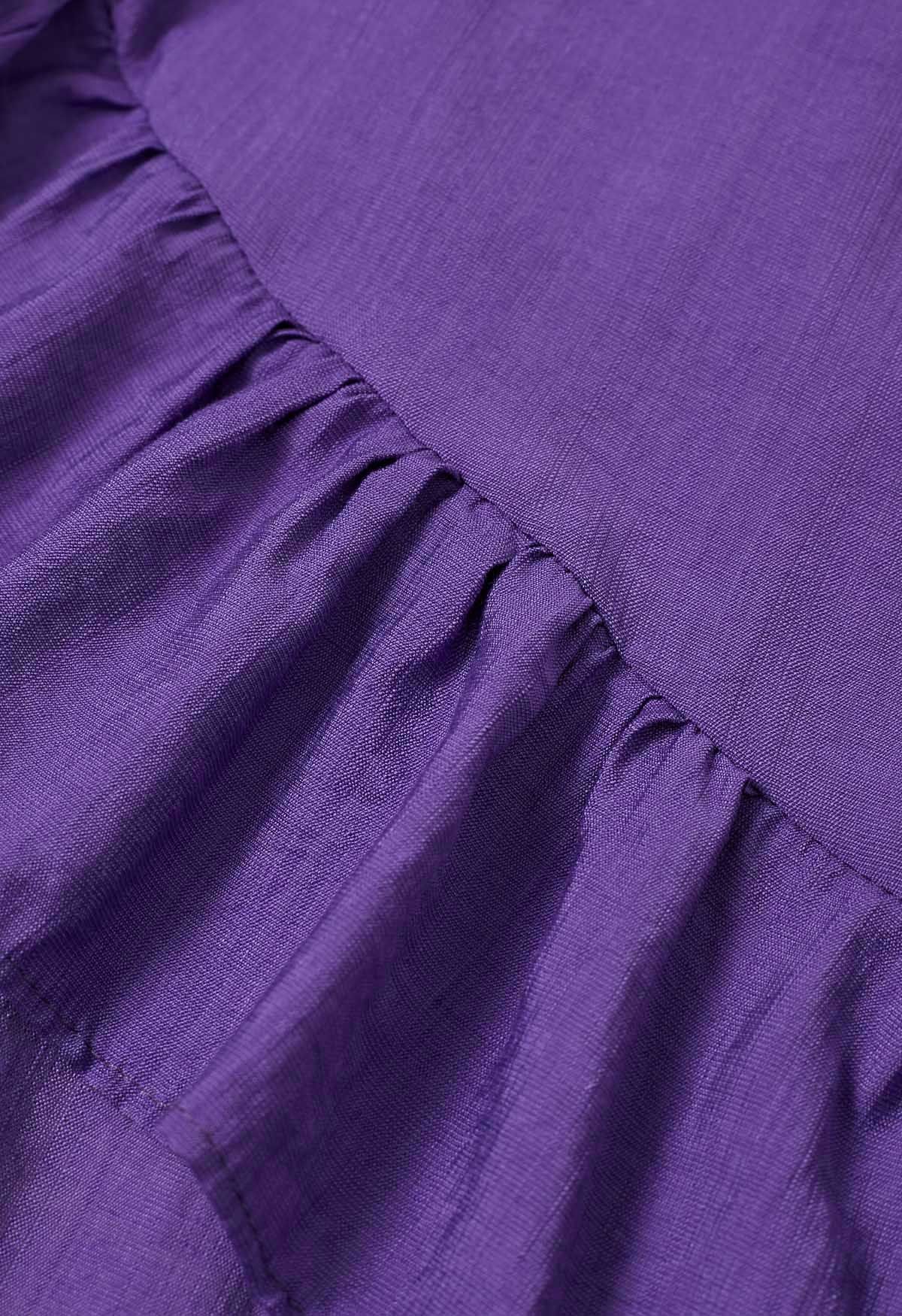 Vestido midi asimétrico con volantes y botones en morado