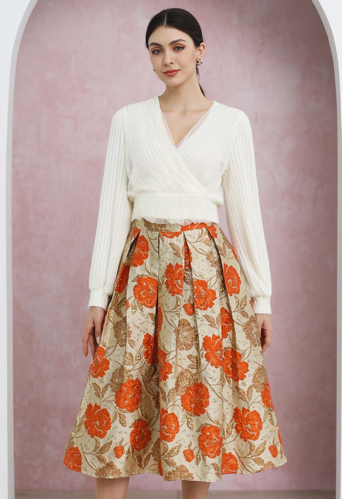 Falda midi plisada con vuelo y estampado floral en jacquard en color naranja