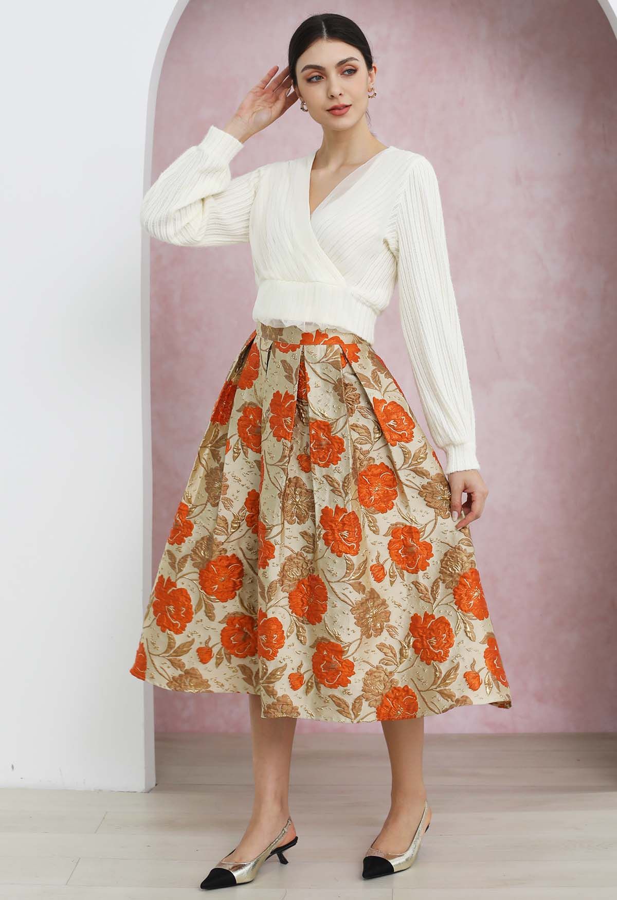 Falda midi plisada con vuelo y estampado floral en jacquard en color naranja