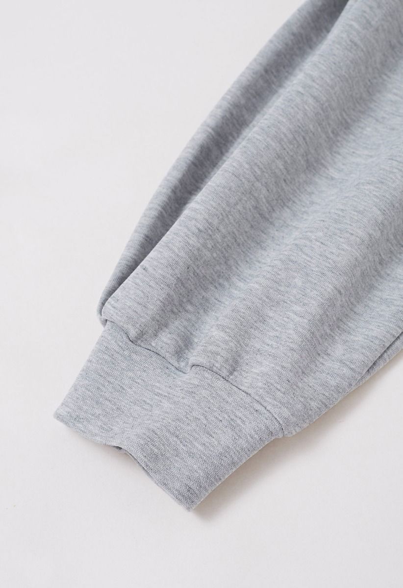 Sudadera corta con mangas adornadas con lazo en gris