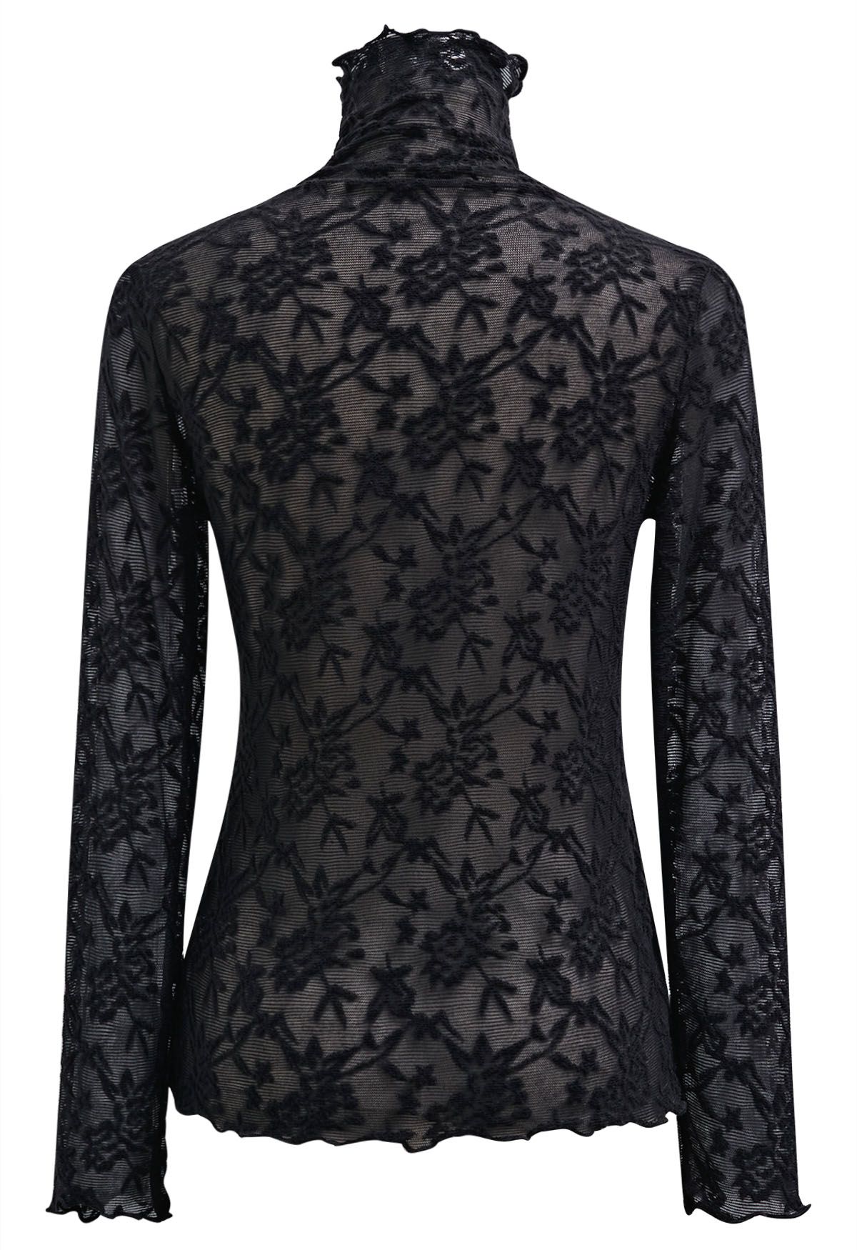 Blusa de manga larga con cuello alto y malla con estampado floral de fantasía en color negro