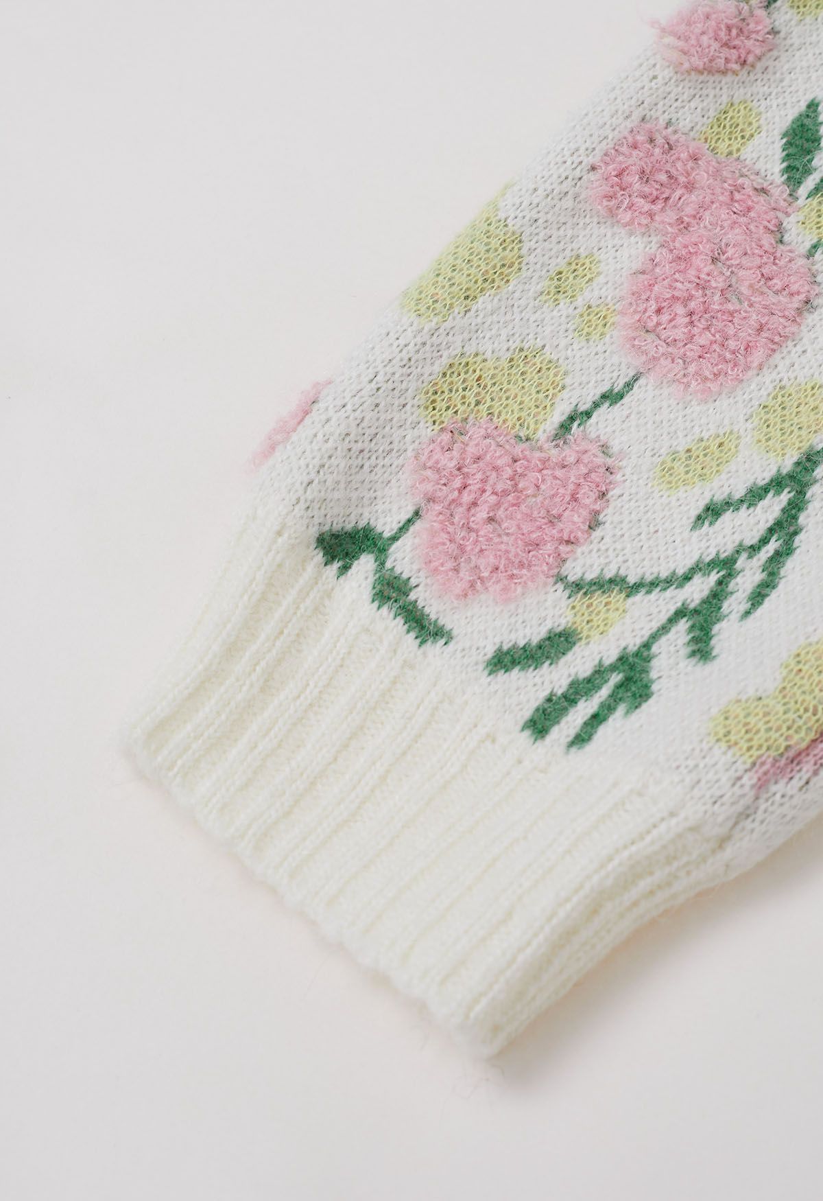 Cárdigan de punto jacquard con intarsia y flores rosas con botones