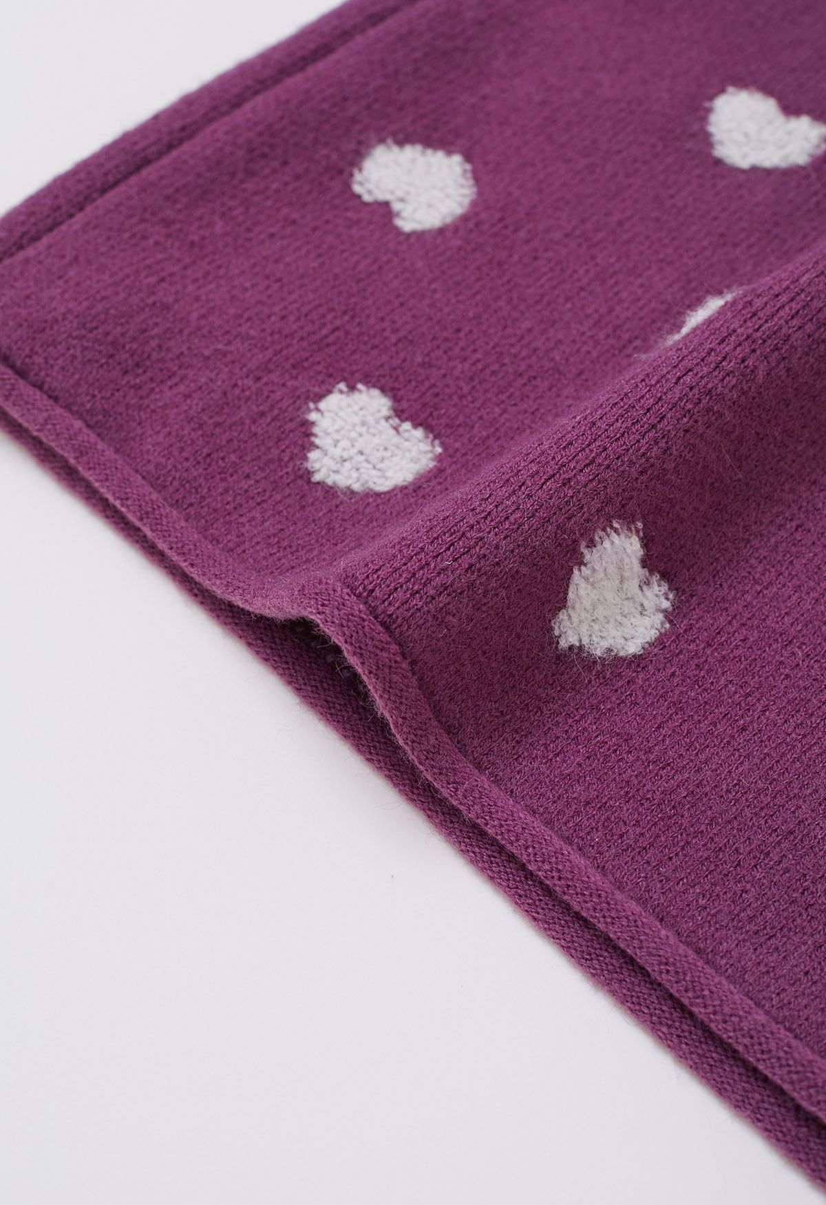 Cárdigan de punto jacquard con botones y corazón difuso en violeta