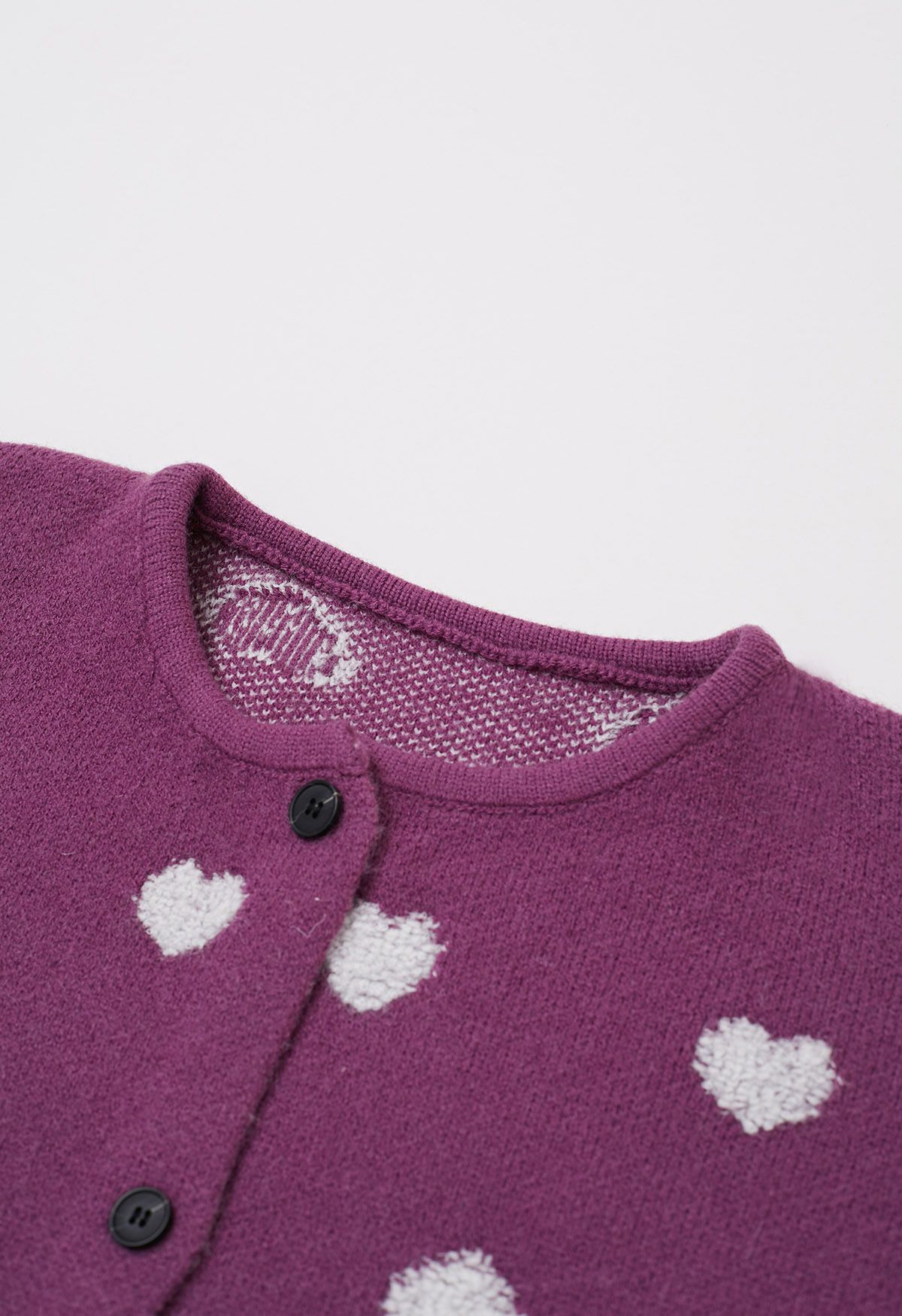 Cárdigan de punto jacquard con botones y corazón difuso en violeta