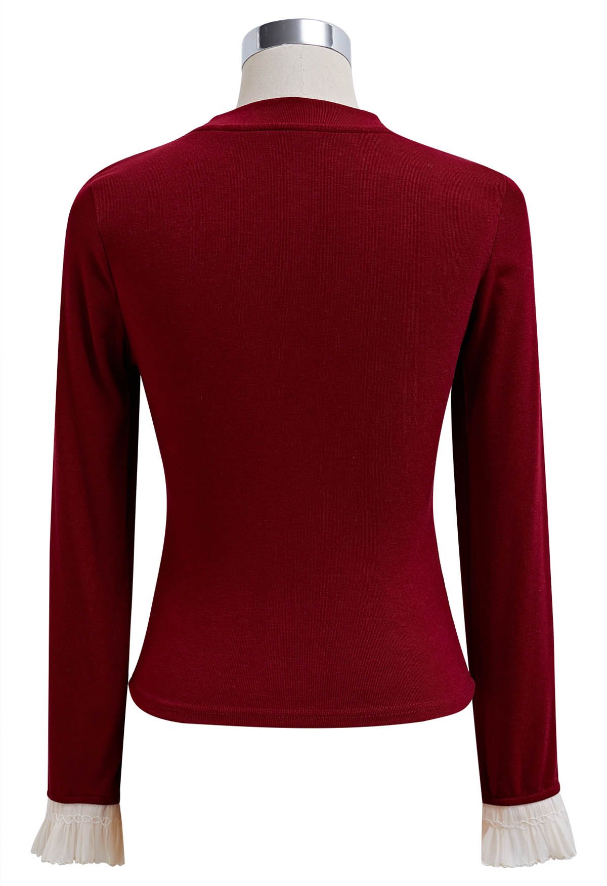 Blusa con puños con volantes y lazo lateral en rojo