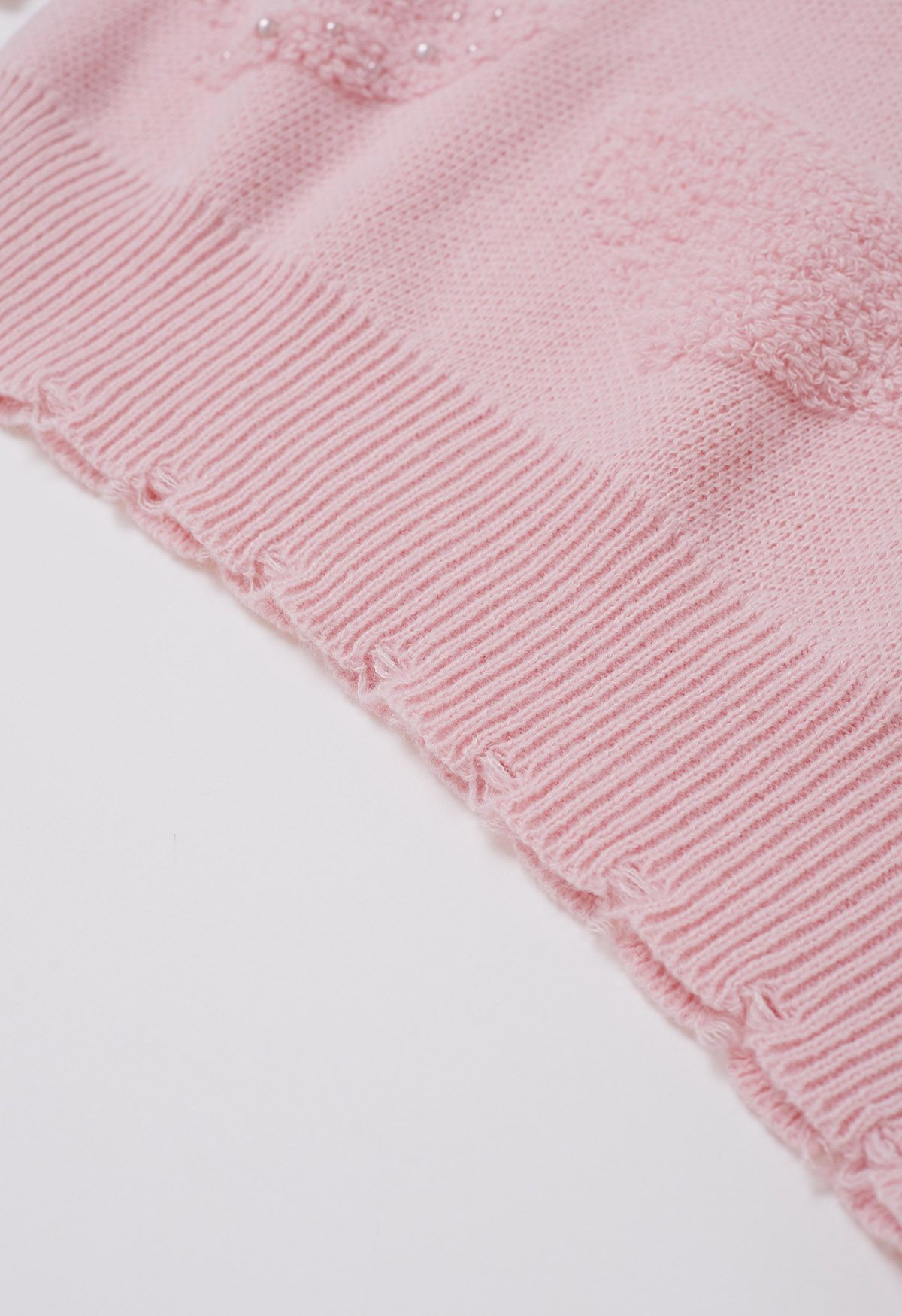 Suéter de punto extragrande con jacquard y corazón con ribete de perlas en color rosa