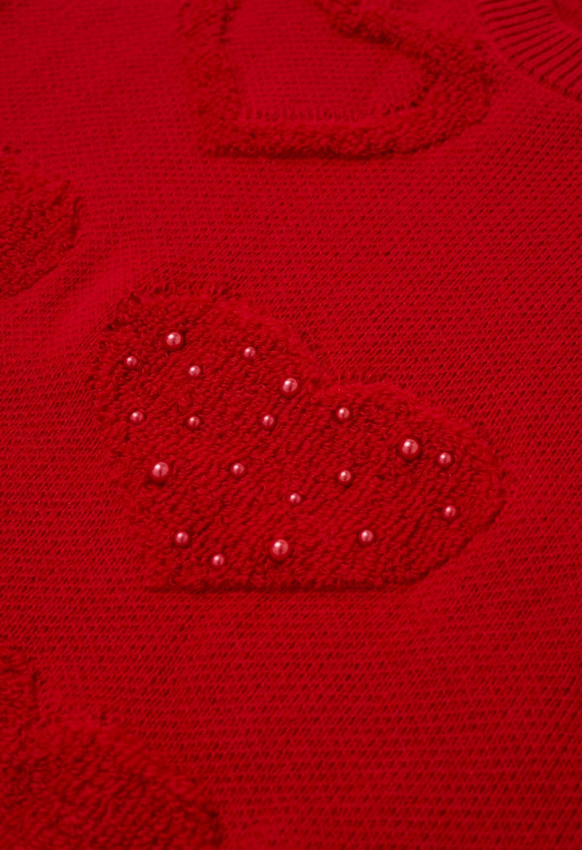 Suéter de punto extragrande con jacquard y corazón con ribete de perlas en color rojo