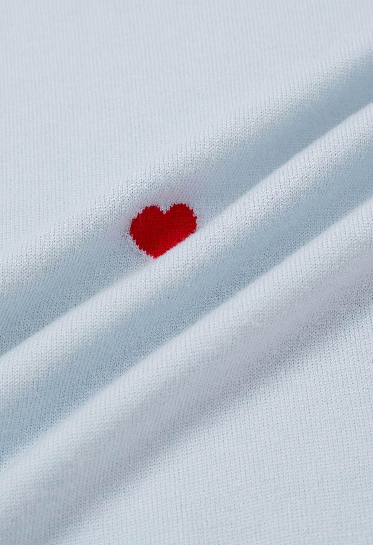 Blusa de punto con volantes de algodón y corazón rojo en azul claro